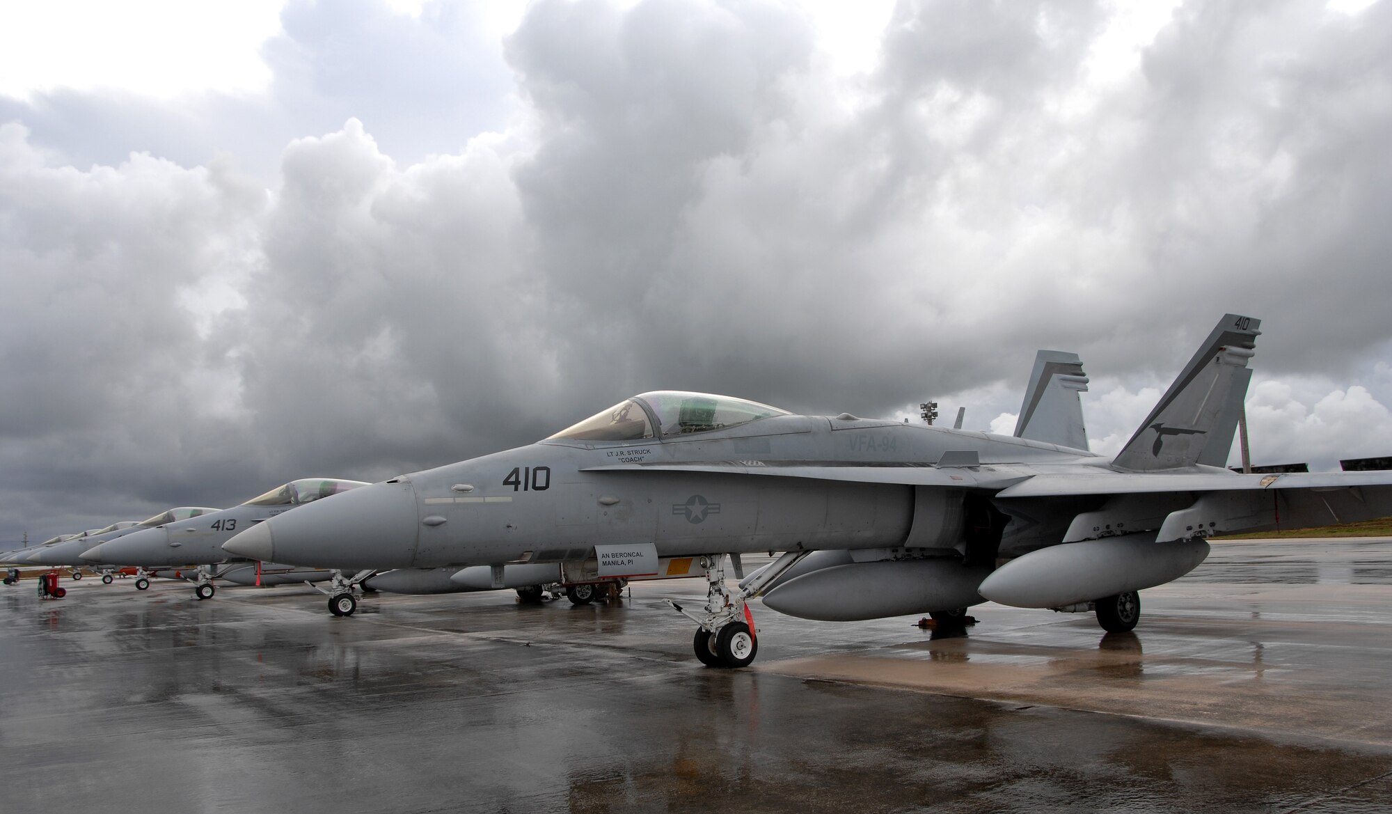 A U.S. Navy F/A-18 rests on Andersen July 10 before its departure Saturday afternoon. The fighters used Andersen waypoint on their way to Royal Australian Air Force Base Tindal where they will participate in an exercise with the Australians. (U.S. Air Force photo by Airman 1st Class Courtney Witt)
 