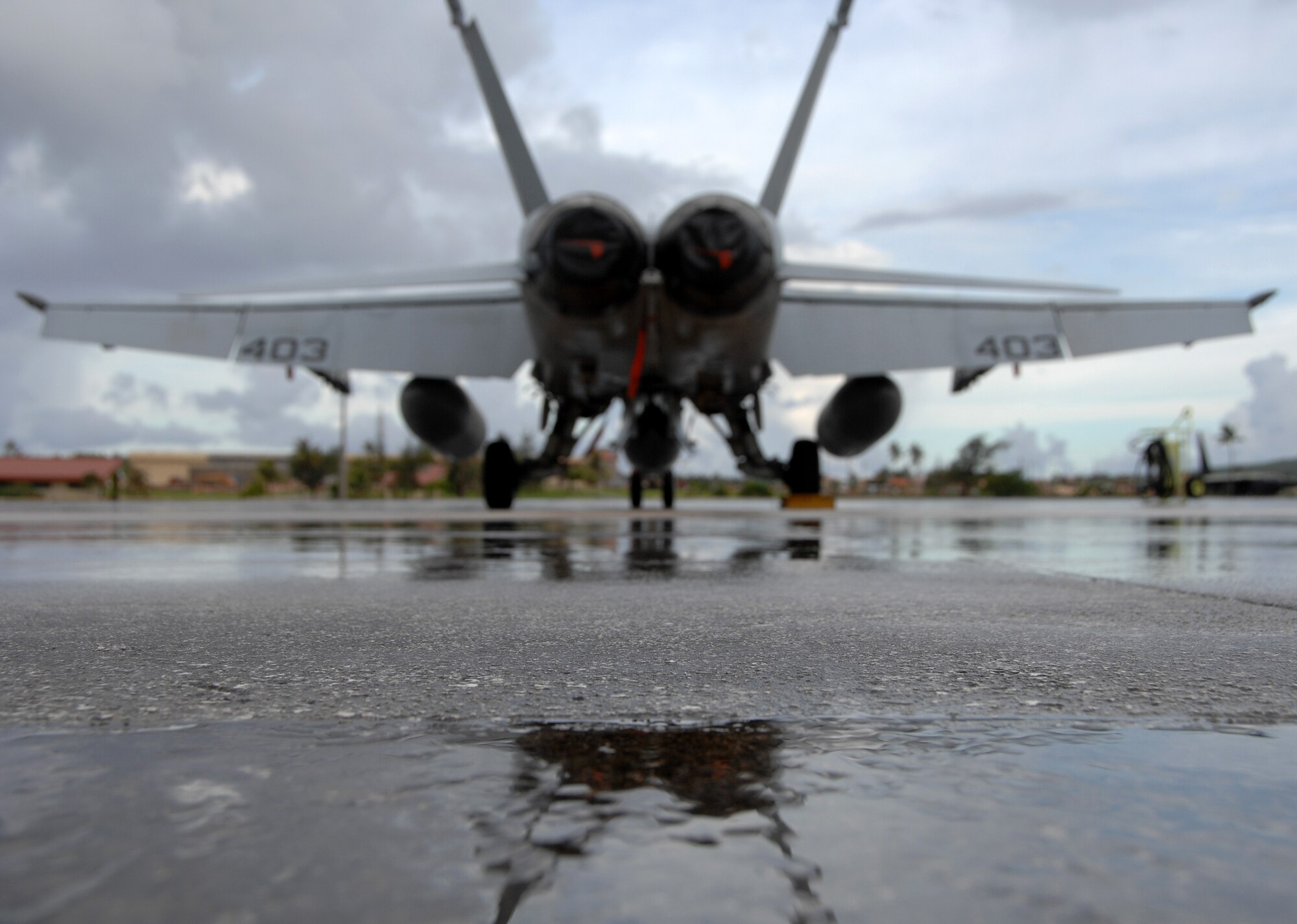 A U.S. Navy F/A-18 rests on Andersen July 10 before its departure Saturday afternoon. The fighters used Andersen waypoint on their way to Royal Australian Air Force Base Tindal where they will participate in an exercise with the Australians. (U.S. Air Force photo by Airman 1st Class Courtney Witt)
 