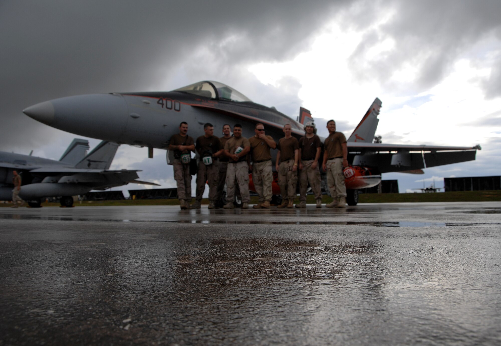 A U.S. Navy F/A-18 rests on Andersen July 10 before its departure Saturday afternoon. During this time, the fighters maintenance crew did routine maintenance on all F/A-18 jets. The fighters used Andersen waypoint on their way to Royal Australian Air Force Base Tindal where they will participate in an exercise with the Australians. (U.S. Air Force photo by Airman 1st Class Courtney Witt)
 