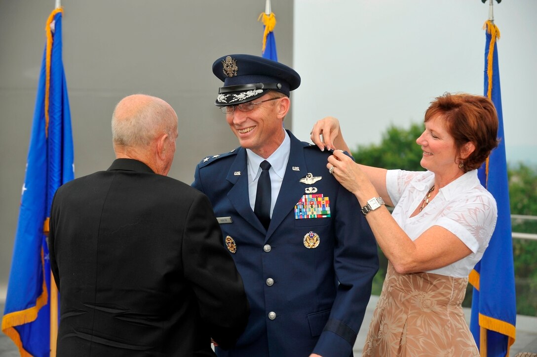 HE’S DEPUTY TO THE CHIEF: Maj. Gen. James T. Rubeor, former commander of the 452nd Air Mobility Wing, watches as his wife, Michele, and father, retired Col. Russ Rubeor, pin on his second star during a promotion ceremony July 5 at the Air Force Memorial in Arlington, Va. General Rubeor is the deputy to Lt. Gen. Charles E. Stenner, Jr., Chief of Air Force Reserve at the Pentagon. Lt. Gen. John Bradley, former chief of the Reserve and commander of Air Force Reserve Command, officiated the ceremony. General Rubeor commanded the 452nd from July 2003 to July 2006. (U.S. Air Force photo by Scott Ash)