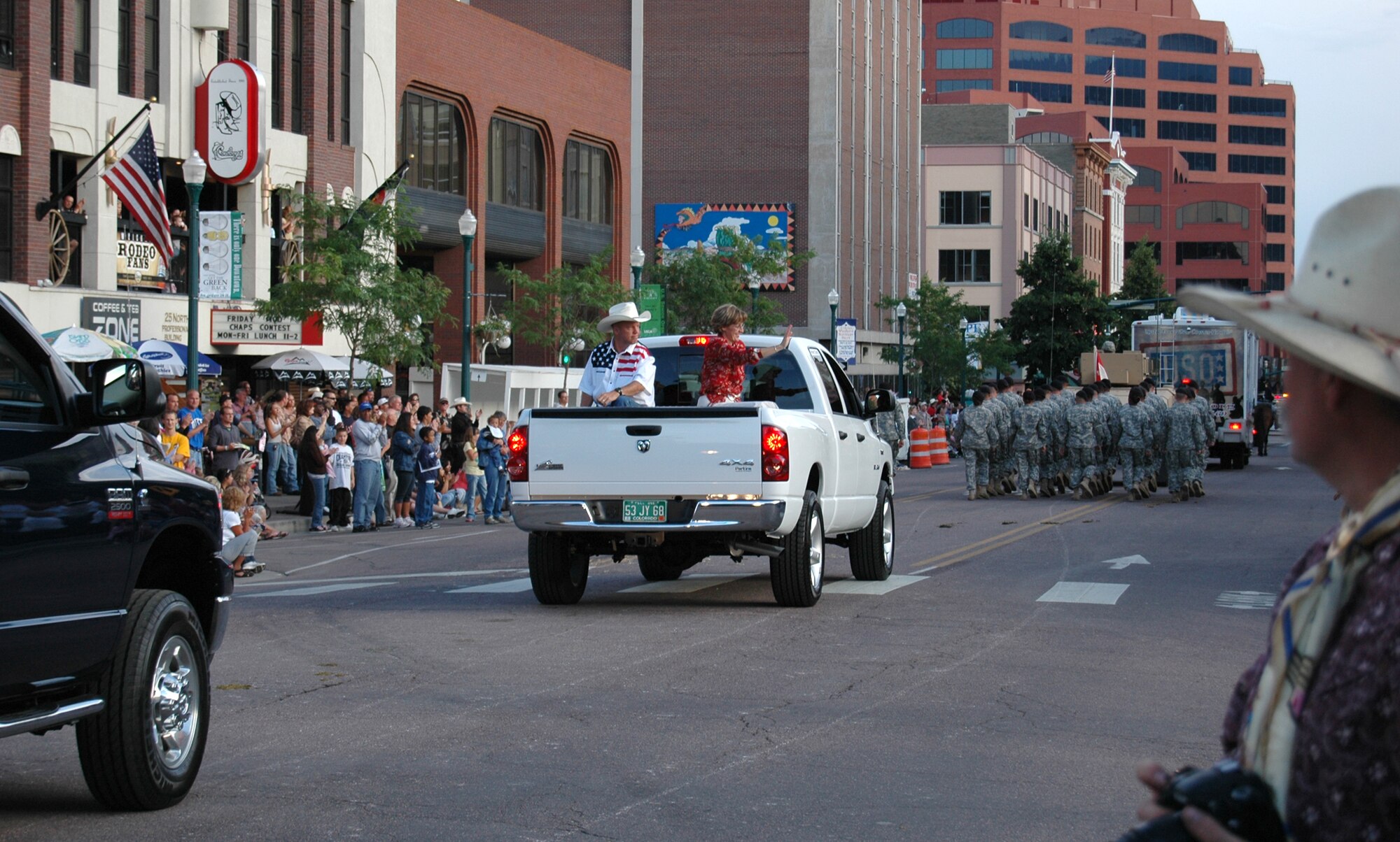 Col. Jay Raymond, 21st Space Wing commander, and wife Mollie, ride along in Pikes Peak or Bust Rodeo parade festivities July 8 in Colorado Springs, Colo. The Rodeo runs through July 12 at the Norris-Penrose Events Center. A matinee is scheduled for 12:30 p.m. and a performance at 7 p.m. July 12 as part of the Air Force Space Command night. (U.S. Air Force photo/Steve Brady)