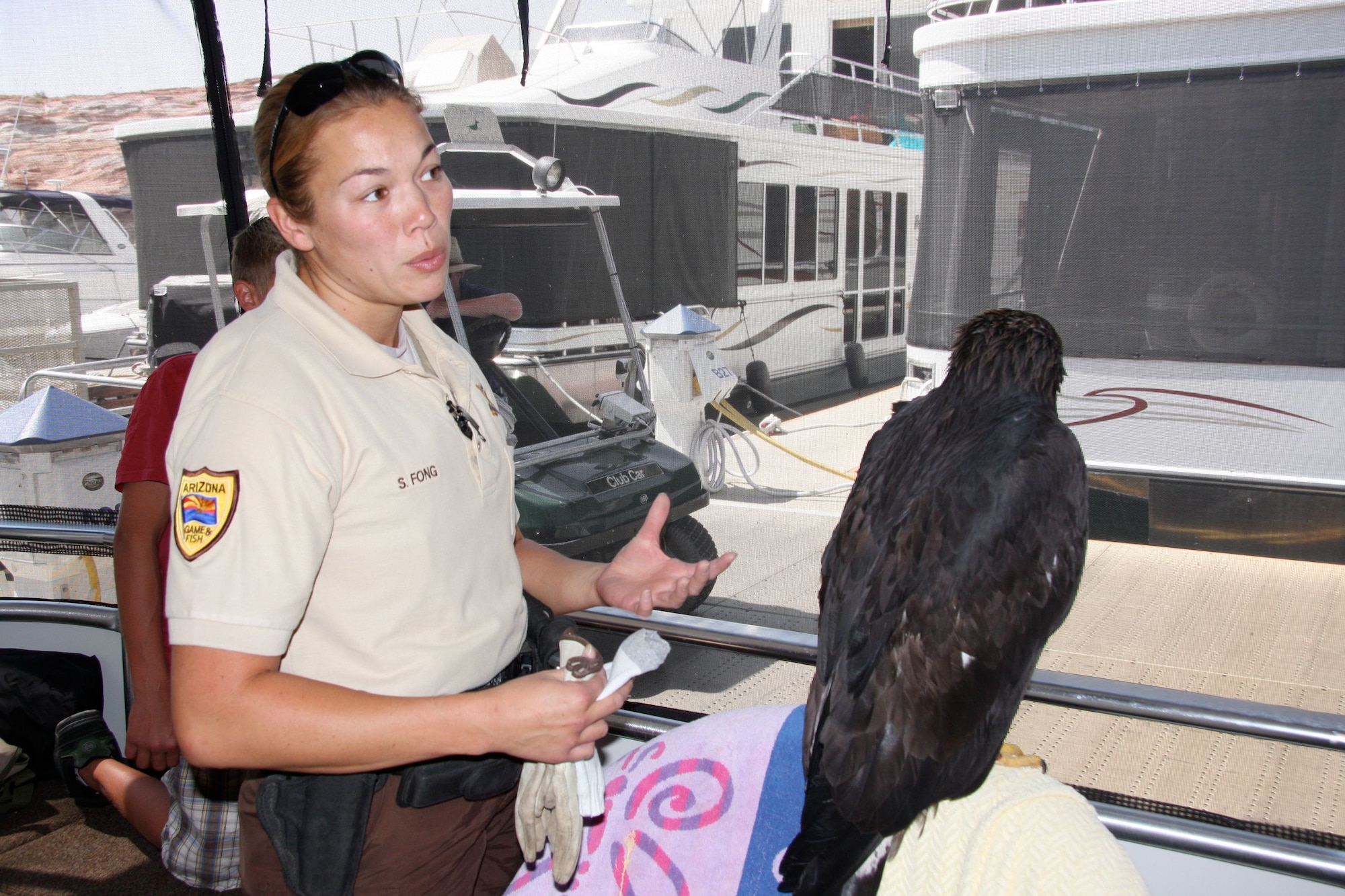 Sophia Fong, Arizona Game and Fish department manager, discusses Cliff's rescue and projected rehabilitation with the rescue team.
