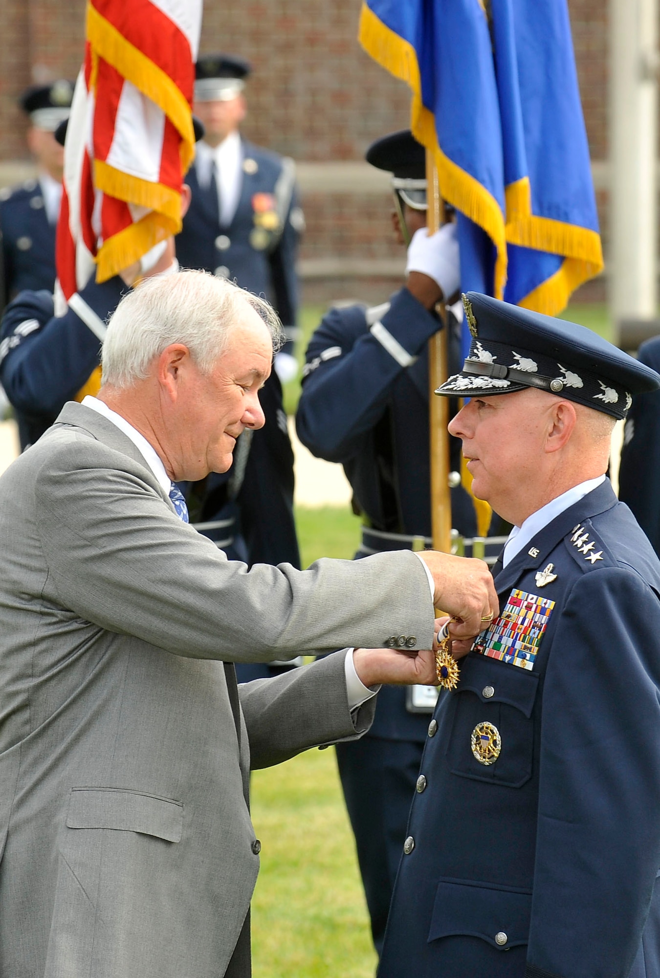 Former Secretary of the Air Force Michael Wynne pins the Distinguished Service Medal on Gen. T. Michael Moseley during the general's retirement ceremony on Bolling Air Force Base, D.C., July 11. General Moseley is the 18th chief of staff. (U.S. Air Force photo/Scott M. Ash) 
