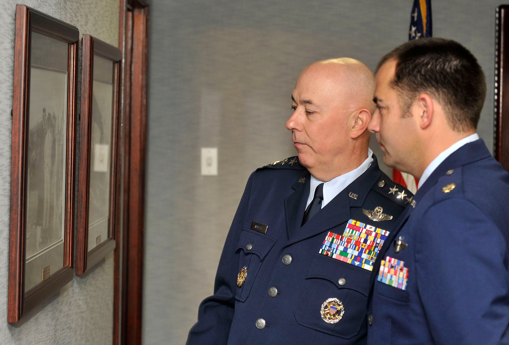 Gen. T. Michael Moseley admires historic photographs in the Mitchell Center with his son, Maj. Gregory M. Moseley, moments before General Moseley's retirement ceremony on Bolling Air Force Base, D.C., July 11  General Moseley is the 18th chief of staff.  His son is a weapons instructor at Tyndall Air Force Base, Fla. (U.S. Air Force photo/Scott M. Ash)