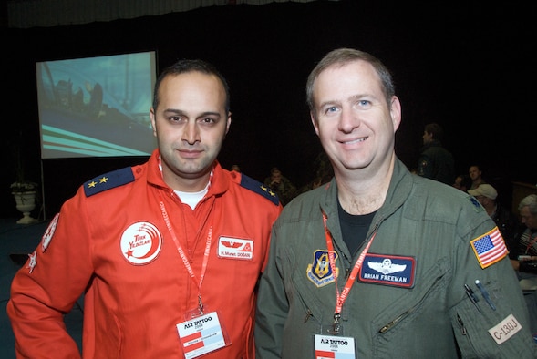 Lt. Col. Brian Freeman, aircraft commander, talks aviation with Lieutenant H. Murst Dogan of the Turkish Air Force.  Flying organizations from countried all over the globe get together at the Royal International Air Tattoo Air Show.  The C-130J-30 of the Air Force Reserve 815th Airlift Squadron "Flying Jennies" will be showcased at Air Tattoo, located in RAF Fairford, England.  More than 150,000 visitors are expected to tour the aircraft at Air Tattoo.  "We are excited about the opportunity to share the C-130J and the mission of the Air Force Reserve here at Air Tattoo.