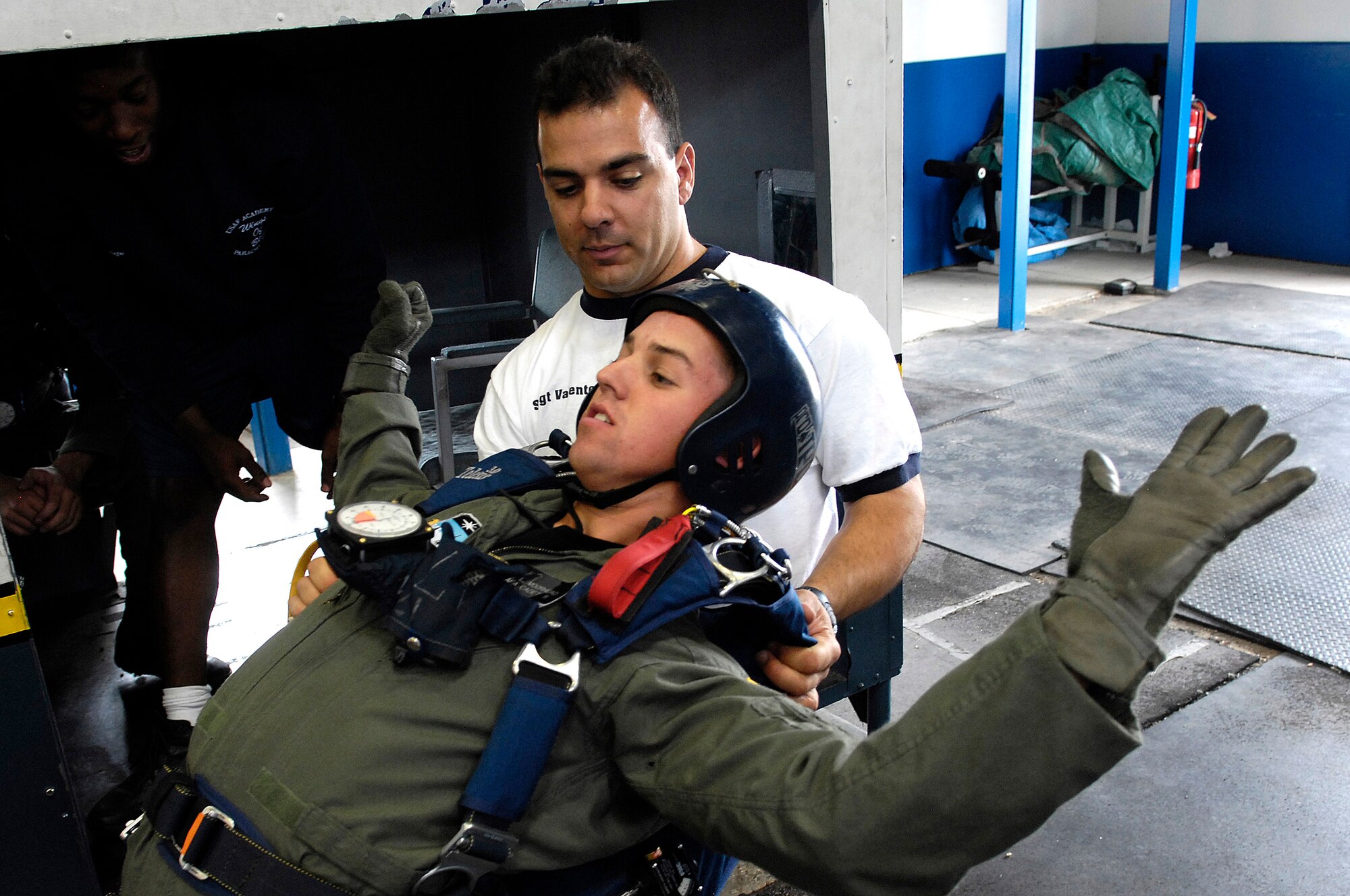 U.S. Air Force Academy Cadet 3rd Class Cody Moorhead receives free-fall techniques training July 7 from Staff Sgt. Joseph Valente, an airmanship instructor, during Airmanship 490, Basic Parachuting, an airmanship program where cadets earn their basic jump wings after successfully completing five free-fall jumps.  (U.S. Air Force photo/Mike Kaplan)