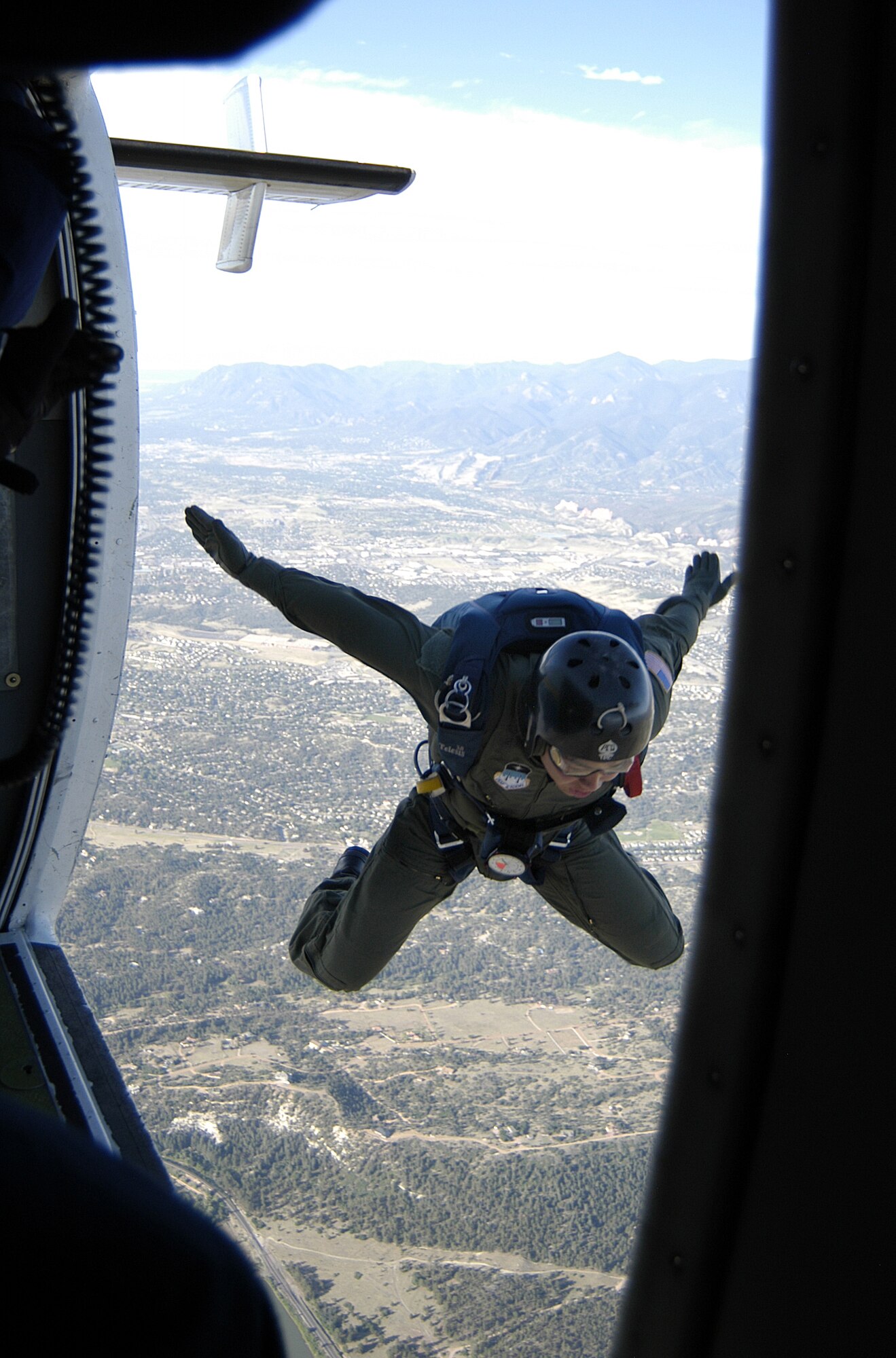 U.S. Air Force Academy Cadet 3rd Class Thomas Baker departs a Twin-Otter jump plane from 4500 feet above the academy on June 27 during Airmanship 490, Basic Parachuting, an airmanship program where cadets earn their basic jump wings after successfully completing five free-fall jumps.  (U.S. Air Force photo/Capt Uriah Orland)