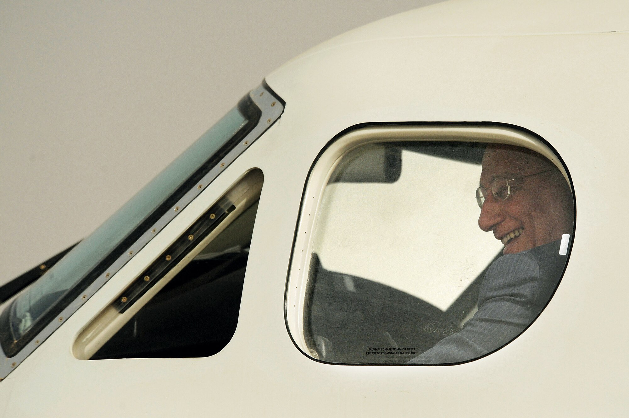 Iraqi Defense Minister Abd al-Qadir al-Mufriji sits in the pilot's seat of a Cessna Caravan 208 after a ceremony celebrating the transfer of ownership of 11 U.S. Forces aircraft to the Iraqi air force at New Al Muthana Air Base, Iraq,  July 9. Army Lt. Gen. Frank Helmick, commander of Multi-National Security Transition Command Iraq, signed over eight Cessna 172s and three Cessna Caravan 208s worth more than $9 million to the Iraqi Defense Minister. (U.S. Air Force photo/Tech. Sgt. Jeffrey Allen)