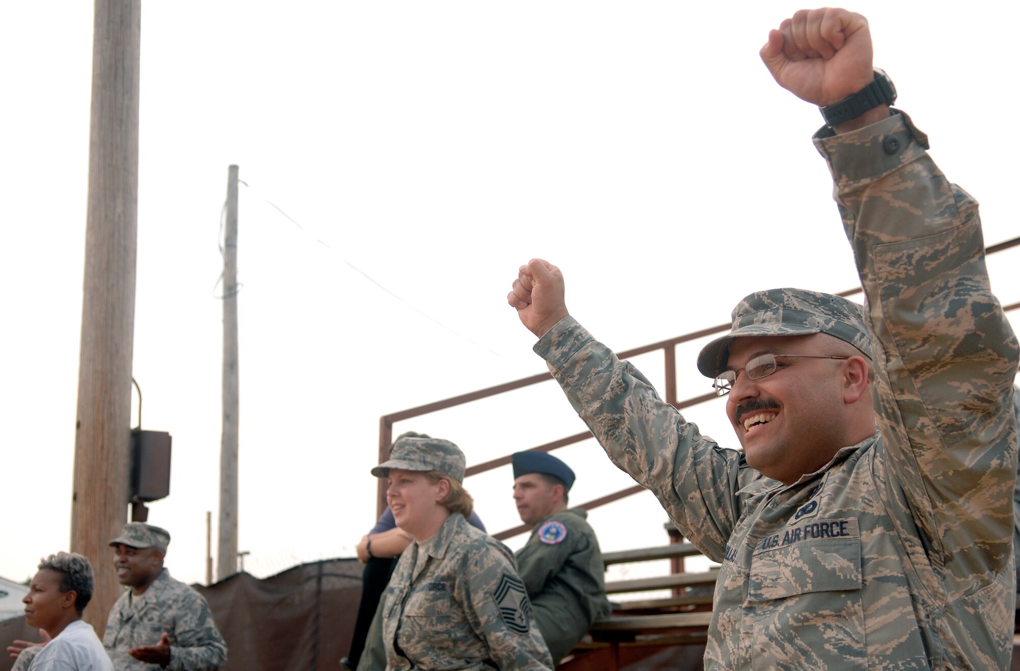 LANGLEY AIR FORCE BASE, Va, -- Chief Master Sgt. Lemuel Casillas, Air Combat Command Public Affairs, cheers for the chiefs during a Chiefs vs. Colonels softball game July 10. Langley chiefs and colonels get together annually to play softball. The colonels defeated the chiefs, 24-16. (U.S. Air Force photo/Senior Airman Vernon Young)