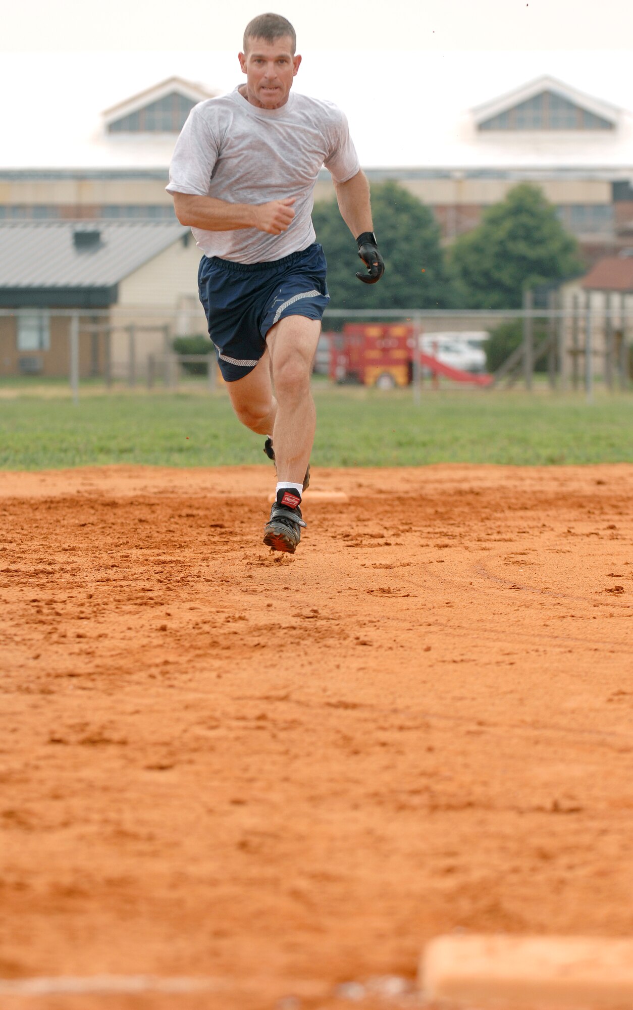 LANGLEY AIR FORCE BASE, Va, -- Brig. Gen. Mark Barrett, 1st Fighter Wing commander, sprints to third base during a softball game between the Chiefs and Colonels July 10. Langley chiefs and colonels get together annually to play softball. The colonels defeated the chiefs, 24-16. (U.S. Air Force photo/Senior Airman Vernon Young)