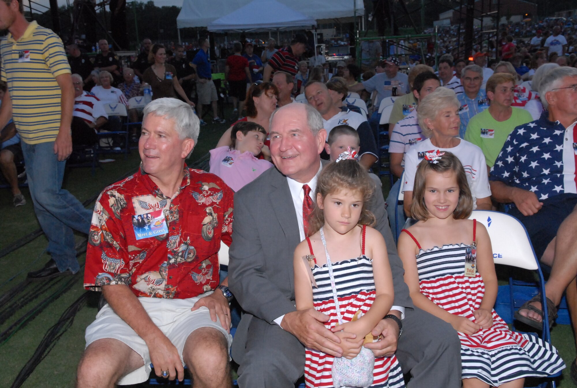 Maj. Gen. Tom Owen, WR-ALC commander and Georgia Governor Sonny Perdue, enjoy the show with two special guests.