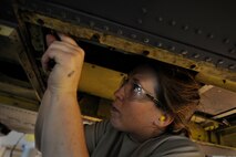 MOODY AIR FORCE BASE, Ga. -- Staff Sgt. Kristy Beaudoin, 23rd Equipment Maintenance Squadron aircraft structural maintenance craftsman, replaces a lower antenna bracket on an HH-60G Pave Hawk here June 24. The bracket is being replaced because it was corroded. (U.S. Air Force photo by Senior Airman Gina Chiaverotti) 