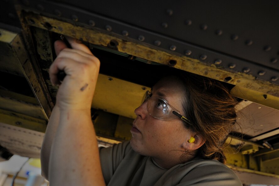 MOODY AIR FORCE BASE, Ga. -- Staff Sgt. Kristy Beaudoin, 23rd Equipment Maintenance Squadron aircraft structural maintenance craftsman, replaces a lower antenna bracket on an HH-60G Pave Hawk here June 24. The bracket is being replaced because it was corroded. (U.S. Air Force photo by Senior Airman Gina Chiaverotti) 