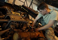 MOODY AIR FORCE BASE, Ga. -- Staff Sgt. Keith McCarthy, 23rd Equipment Maintenance Squadron crew chief, puts a new collected booster on an HH-60G Pave Hawk here June 24. The collected booster makes it easier to control aircraft movement. (U.S. Air Force photo by Senior Airman Gina Chiaverotti) 