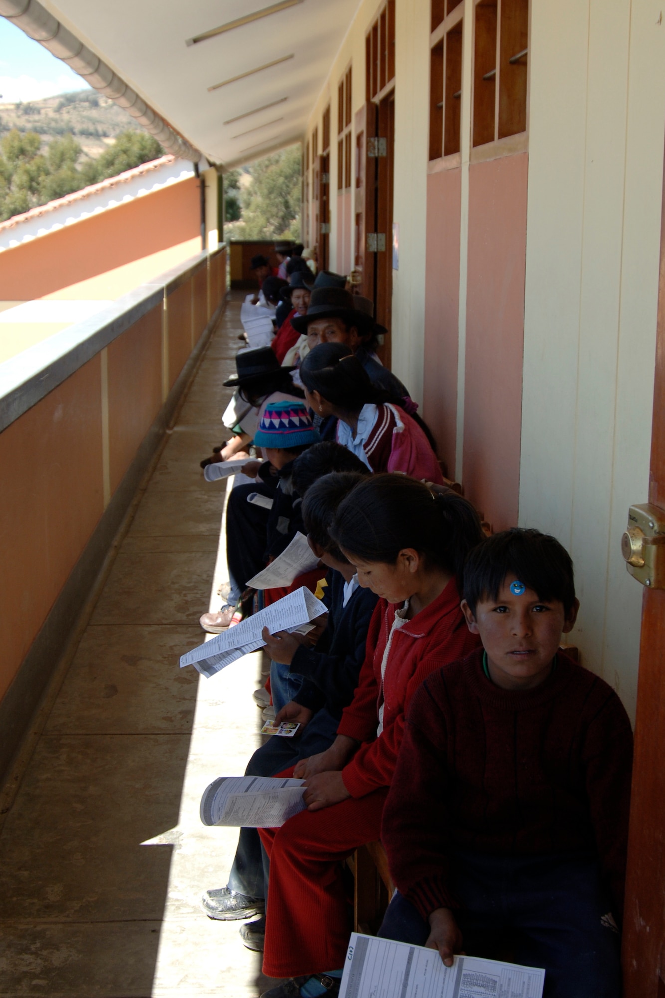 Peruvians seeking medical care wait in line for a medical examination, June 30, during a medical mission in Chiara, Peru.  The medical mission is one of nine that supports New Horizons - Peru 2008, a U.S. and Peruvian humanitarian mission that will bring relief to underprivileged Peruvians. (U.S. Air Force Photo/1st Lt. Mary Pekas)