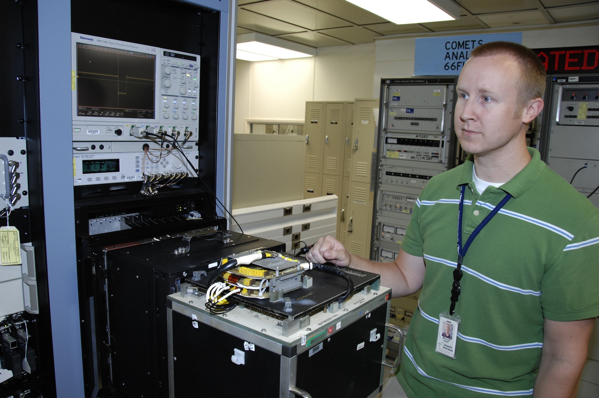 Michael Hunt, lead test station operator, prepares to test the first production asset using VDATS, a decoder assembly from the Pave Penny pod. U.S. Air Force photo by Claude Lazzara