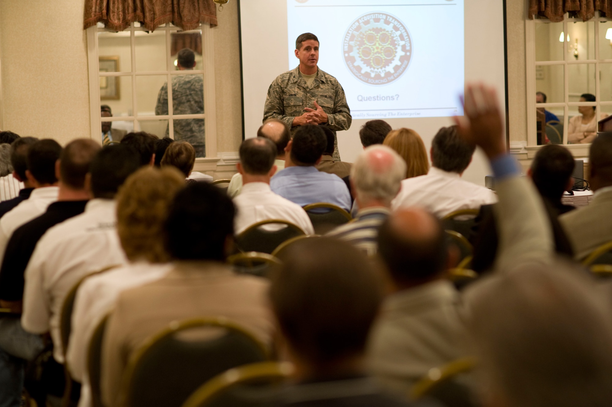 LANGLEY AIR FORCE BASE, Va. -- Col. Mark Hobson, Air Force Material Command installation acquisition center provisional director, Wright-Paterson Air Force Base, Ohio, speaks to local business and industry personnel at Newport News, Va., July 10, regarding an installation acquisition transformation.  Colonel Hobson spoke to the audience about the Air Force's new regional-based procurement methods and how Hampton Roads will become home to one of five regional contracting centers.  The center is scheduled to stand up in 2011, and will bring about 400 new contracting personnel to the area.  (U.S. Air Force photo/Staff Sgt. Barry Loo)