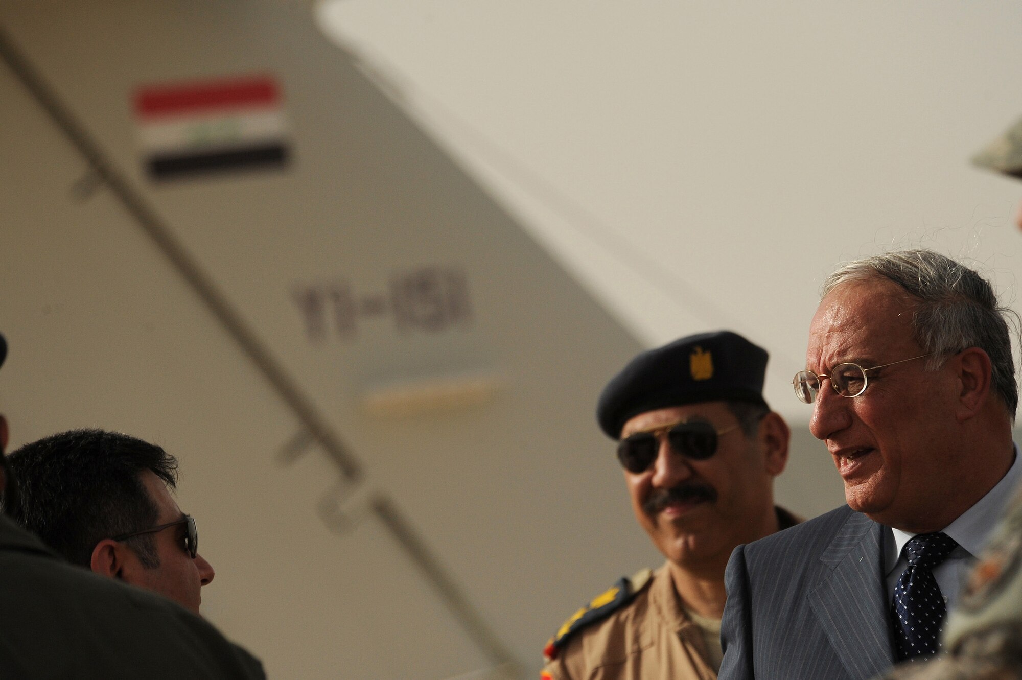 NEW AL MUTHANA AIR BASE, Iraq -- Defense Minister Abd al-Qadir al-Mufriji speaks to the Iraqi media after a ceremony celebrating the transfer of ownership of 11 U.S. Forces aircraft to the Iraqi air force at New Al Muthana Air Base, Iraq, July 9. Army Lt. Gen. Frank Helmick, commander of Multi-National Security Transition Command Iraq, signed over eight Cessna 172s and three Cessna Caravan 208s worth more than $9 million to the Iraqi Defense Minister. (U.S. Air Force photo/Tech. Sgt. Jeffrey Allen)