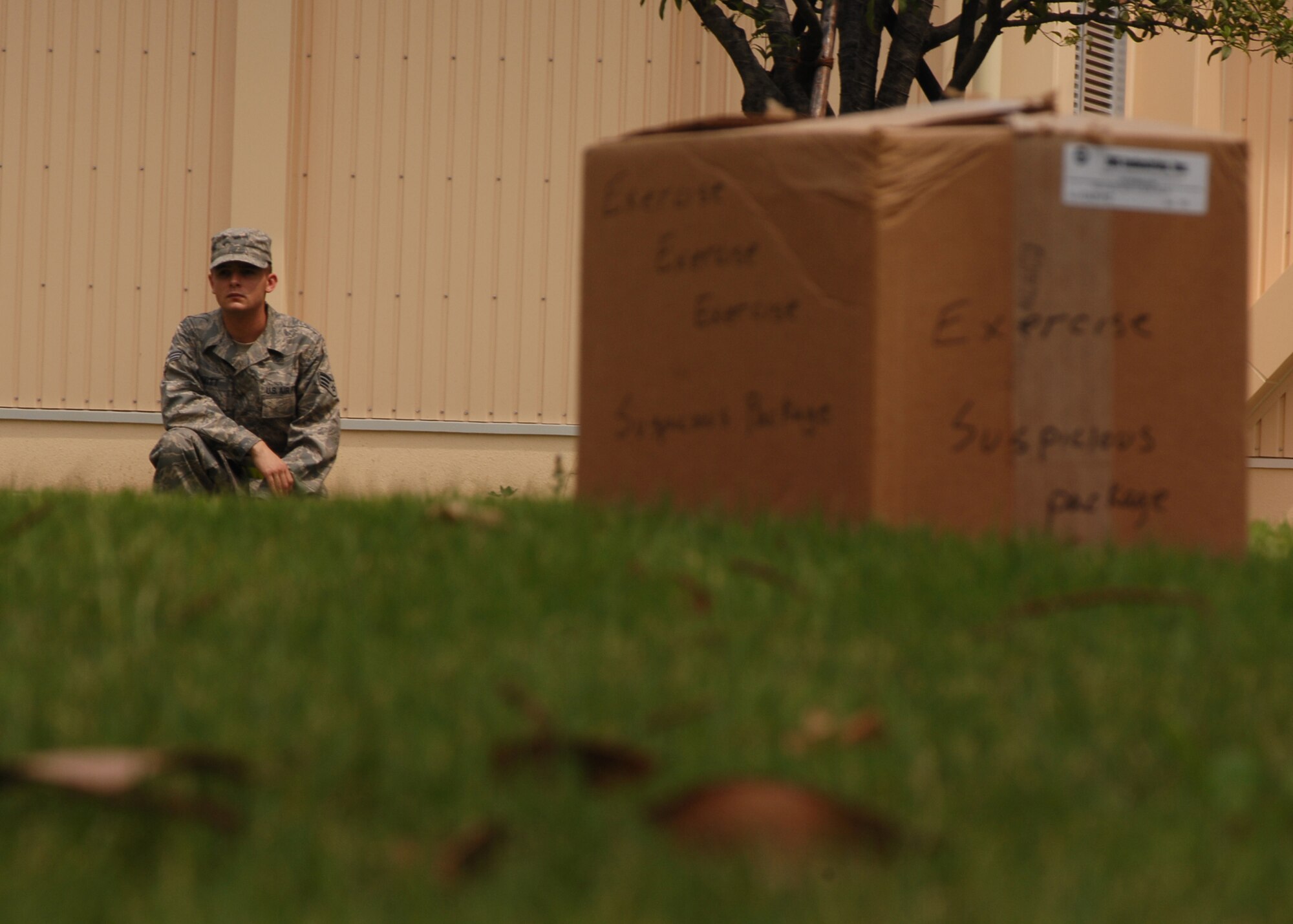 YOKOTA AIR BASE, Japan - Senior Airman Eric Schmitt, from the 374th Contracting Squadron, stands watch over a suspicious package during Exercise Beverly Morning 08-07 on July 11. The exercise is designed to test the base's deployment and operational readiness. (U.S. Air Force photo by Airman 1st Class Jonathan Fowler)