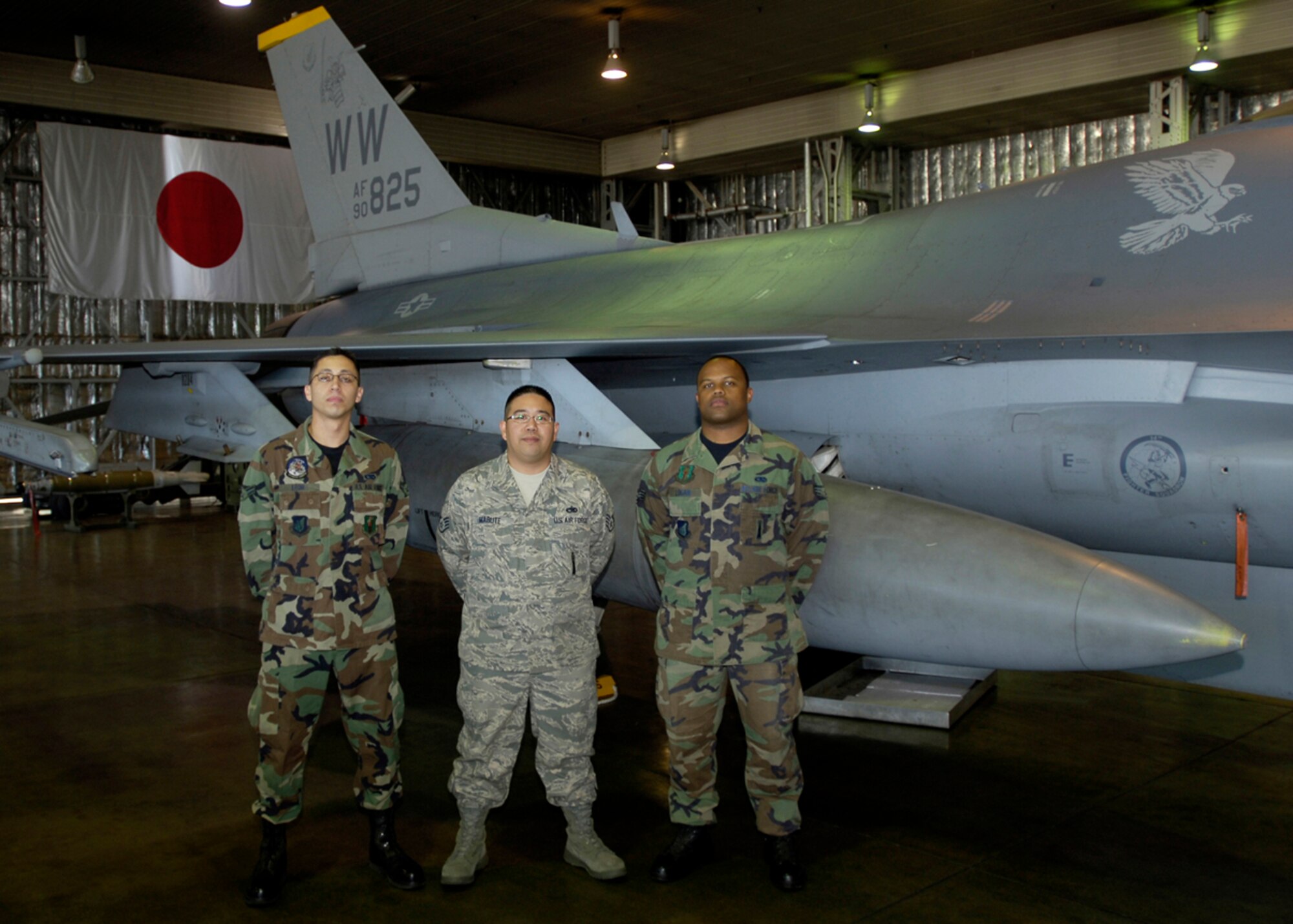 MISAWA AIR BASE, Japan -- Airman 1st Class Noe Leon, Staff Sgt. Sherwyn Mabute and Senior Airman Keith Logan, 35th AMXS, pose for a group photo before performing in the 2nd quarter load crew competition July 2, 2008.  The competition is held both quarterly and annually.  (U.S. Air Force photo by Senior Airman Chad Strohmeyer)