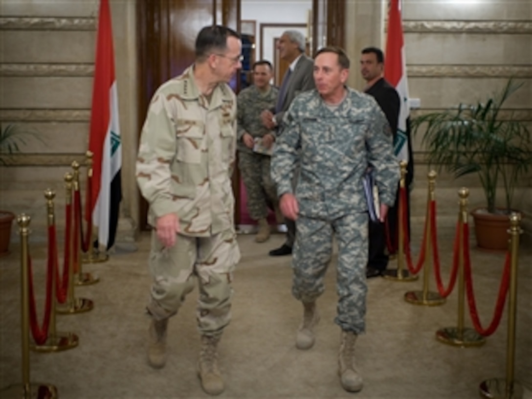 Chairman of the Joint Chiefs of Staff Adm. Mike Mullen (left), U.S. Navy, and Commanding General of Multi-National Force-Iraq Gen. David Petraeus (right), U.S. Army, depart a meeting with Iraqi Prime Minister Nouri al-Maliki in Baghdad, Iraq, on July 9, 2008.  Mullen is on a six-day tour of the region to visit troops and host a USO tour show.  