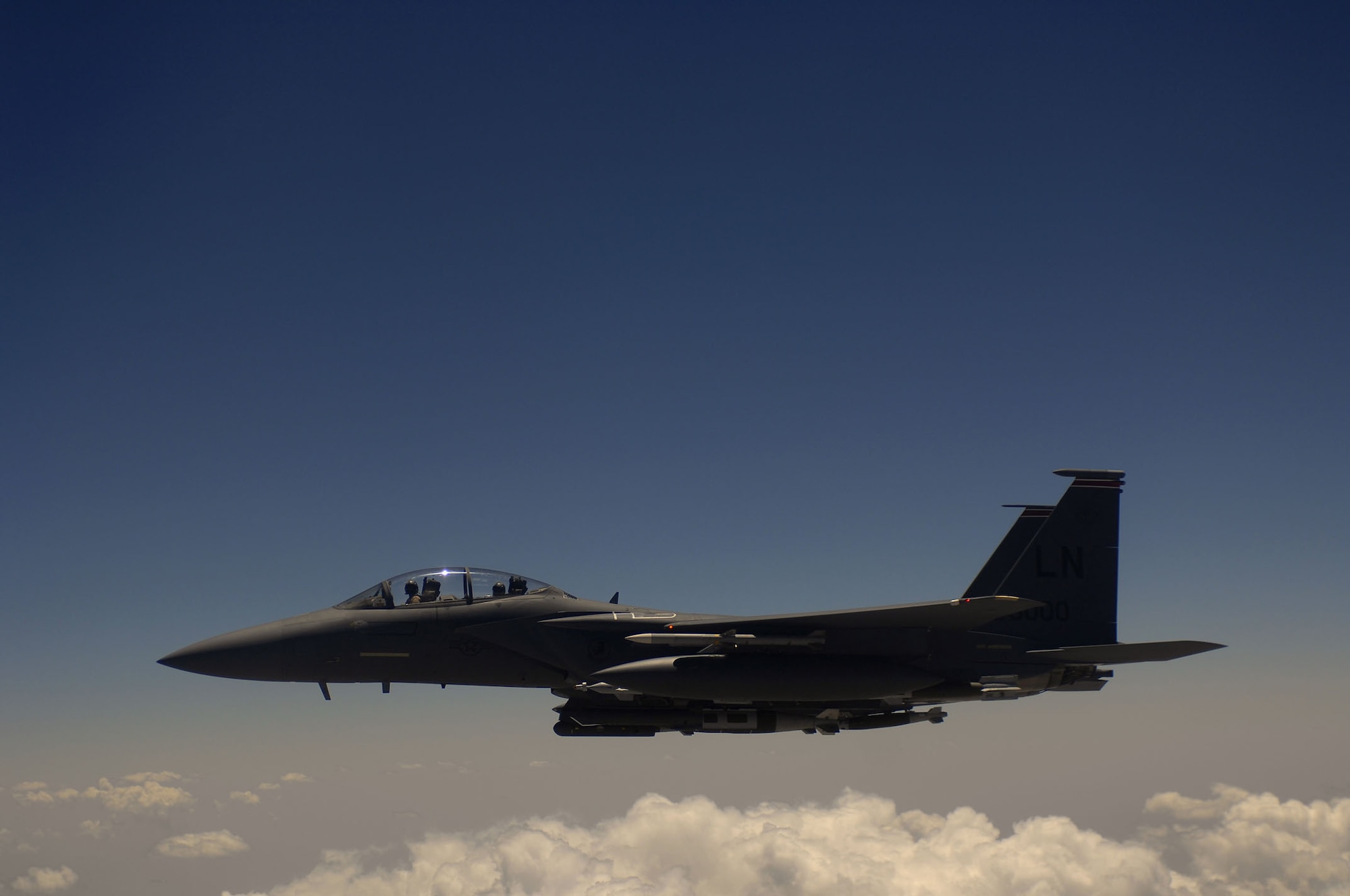 A U.S. Air Force F-15E Strike Eagle aircraft waits for his wingman after receiving fuel May 27, 2008 from a KC-135R Stratotanker during a mission over Afghanistan. The F-15E is deployed from Royal Air Force Lakenheath England and the KC-135R is assigned to the 22nd Expeditionary Air Refueling Squadron, 376th Air Expeditionary Wing and is deployed from the 174th Air Refueling Squadron, Iowa Air National Guard, Sioux City Iowa.(U.S. Air Force photo/Master Sgt. Andy Dunaway)
