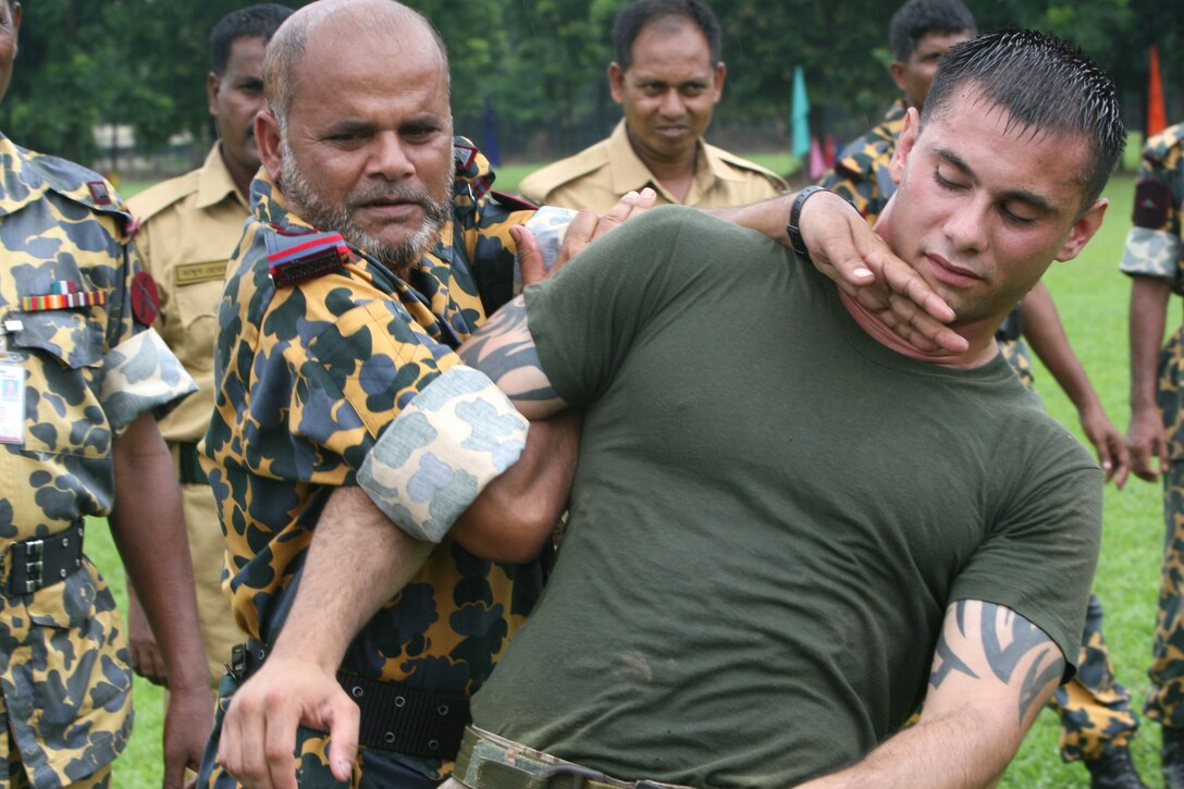 Bangladesh Rifles Senior Warrant Officer S. Damannan applies mechanical advantage control/hold two to Sgt. Corey Gonzalez July 13 during Non-Lethal Weapons Executive Seminar 2008 here. Damannan was a student attending the course. Gonzalez is an assistant anti-terrorism force protection instructor with III Marine Expeditionary Force's Special Operations Training Group.