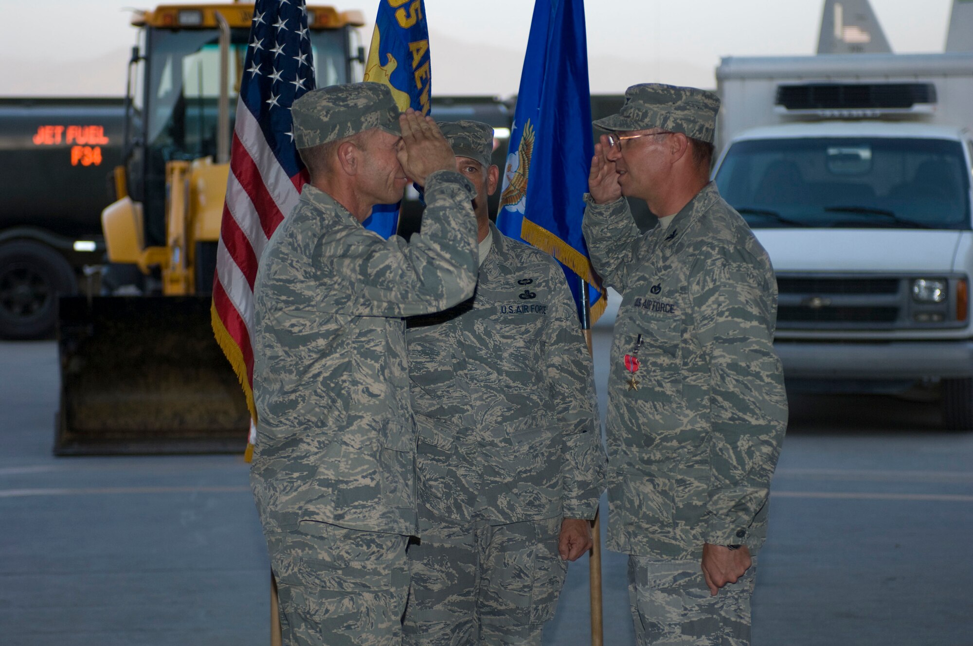 BAGRAM AIR FIELD, Afghanistan -- Col. Barry Mines (right), commander of the 455th Expeditionary Mission Support Group, salutes Brig. Gen. James Holmes (left), commander of the 455th Air Expeditionary Wing, here on July 10, 2008. General Holmes presided over the 455th EMSG's change of command ceremony. (U.S. Air Force photo by Staff Sgt. Samuel Morse)