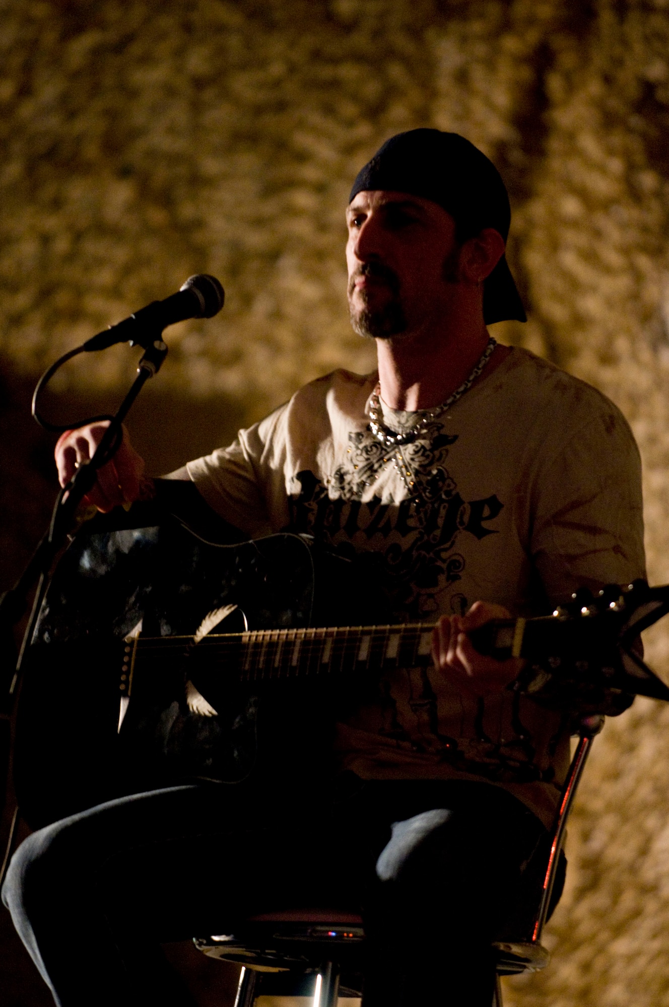 BAGRAM AIR FIELD, Afghanistan -- John Connolly, guitarist for rock group "Sevendust," performs here on July 12, 2008. "Sevendust," from Atlanta, Ga., gave a USO-sponsored tour throughout Southwest Asia, performing for deployed coalition forces. (U.S. Air Force photo by Staff Sgt. Samuel Morse)