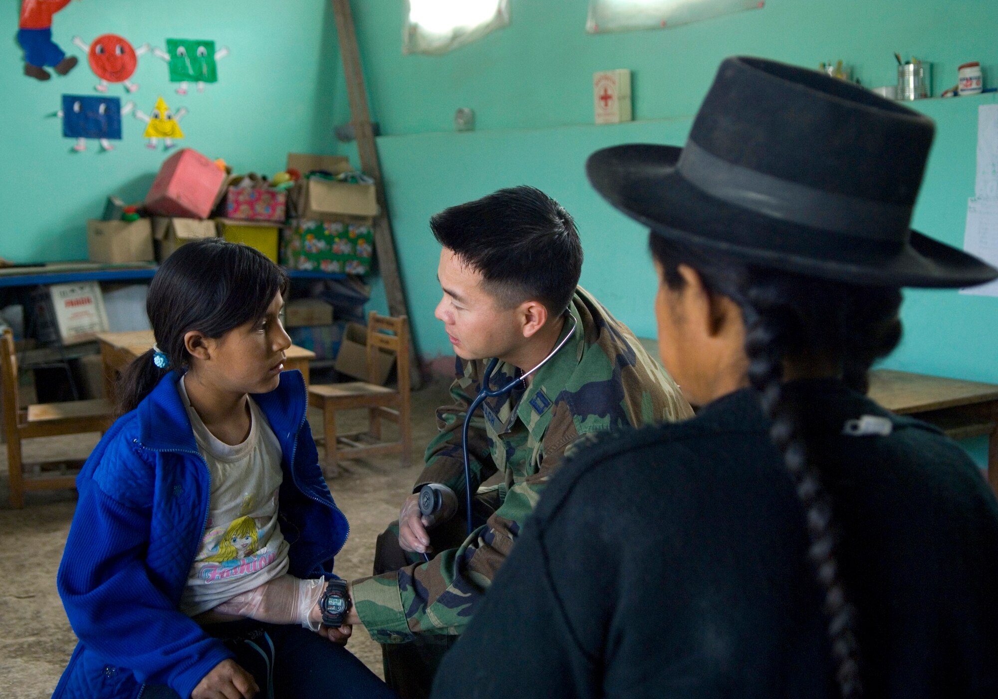 Capt. Truong Quach, 452d Medical Squadron, performs a general medical exam, a Peruvian girl.(U.S. Air Force photo by Staff Sgt. Bennie J. Davis III)