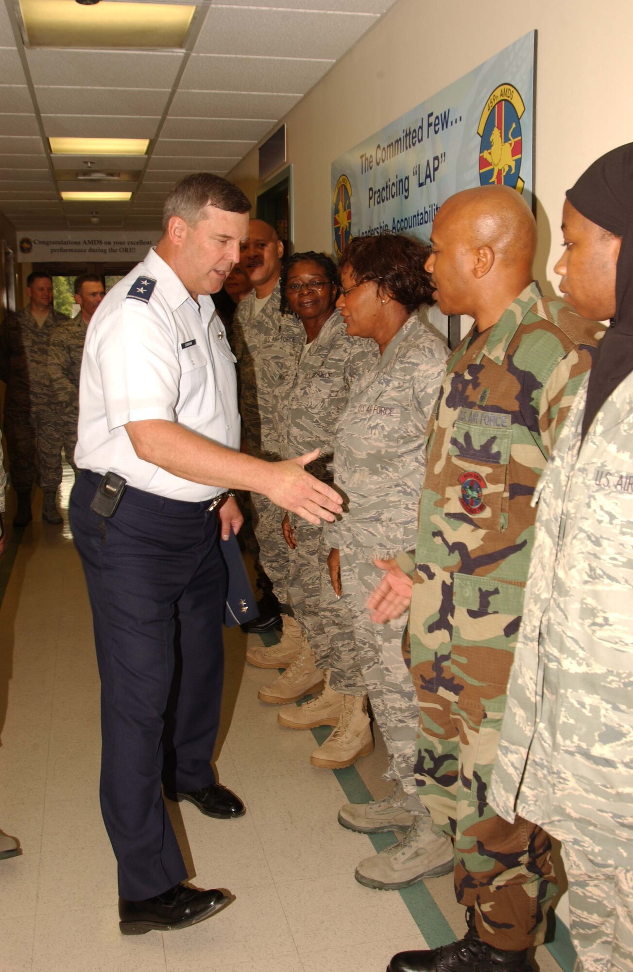 ANDREWS AIR FORCE BASE, Md. - During his visit to the 459th Air Refueling Wing July 12 Maj. Gen. Robert E. Duignan, 4th Air Force commander, congratulates members of the 459th Aerospace Medicine Squadron on their outstanding score for the Health Services Inspection held in June. (U.S. Air Force photo/Master Sgt. Shayne Sewell)