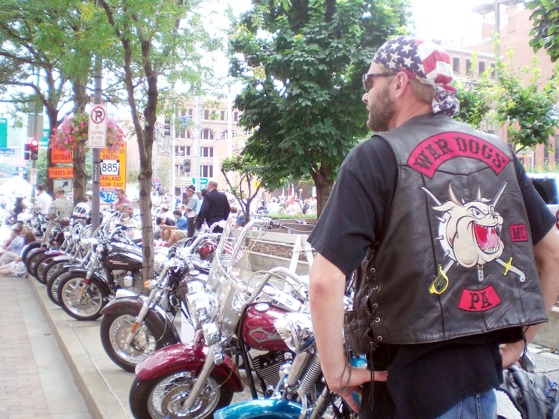 A member of the war dogs motorcycle club headquarted in Pittsburgh, PA, comprised of vietnam veterans and friends, looks on at the festivities at the Boulevard of the Allies rededication.