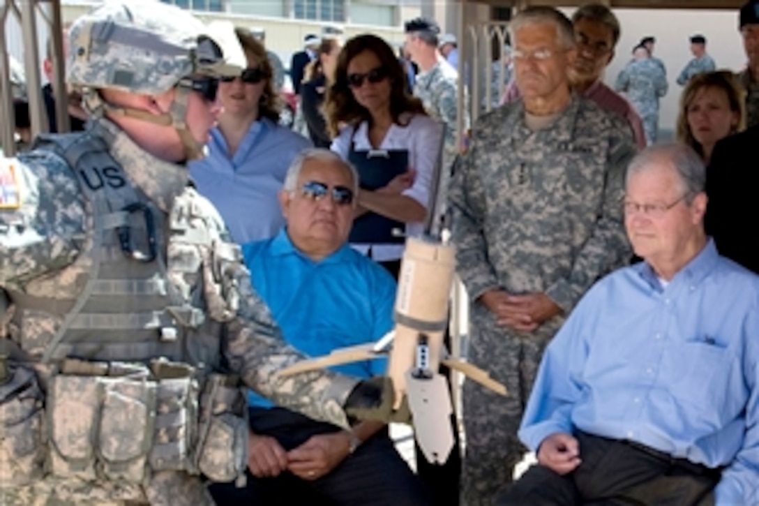 U.S. Army 1st Lt. Andrew Andersen of the Army Evaluation Task Force on Fort Bliss, Texas, conducts a briefing on the advantages of the Unattended Ground Sensor to Army Chief of Staff Gen. George W. Casey Jr., standing center, and House Armed Services Committee Chairman Ike Skelton, seated right, and fellow committee member Sylvestre Reyes, July 12, 2008.  The congressmen visited Fort Bliss to learn about the Army's plans to accelerate Future Combat Systems technologies to soldiers in combat. 