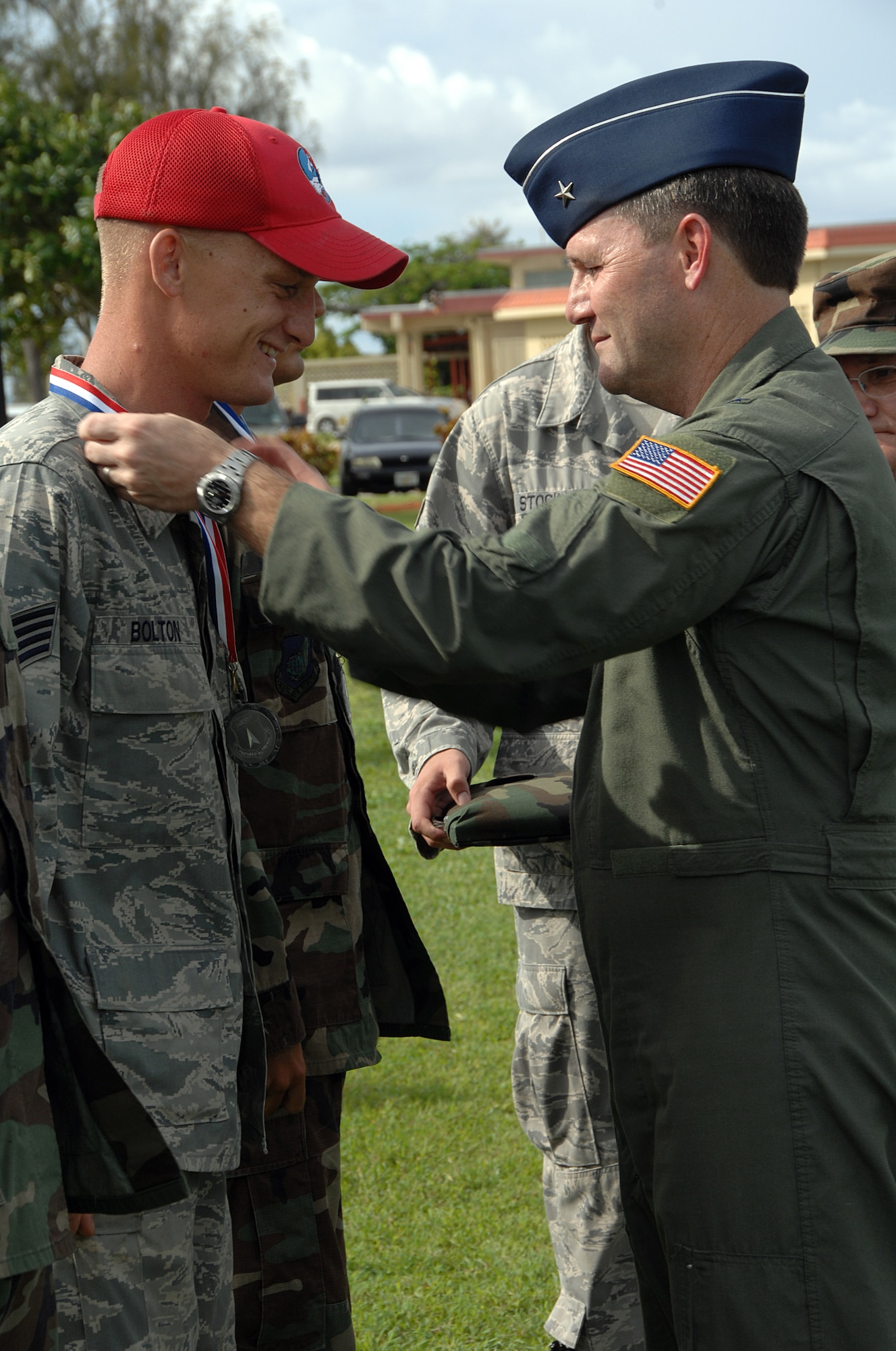 Brig. Gen. Douglas Owens along with Chief Master Sgt. Thomas Collins presented Warrior Day Challenge medals to first, second, and third place squads here July 11. Over nineteen squadrons participated in this years event. (U.S. Air Force photo by Airman 1st Class Courtney Witt)