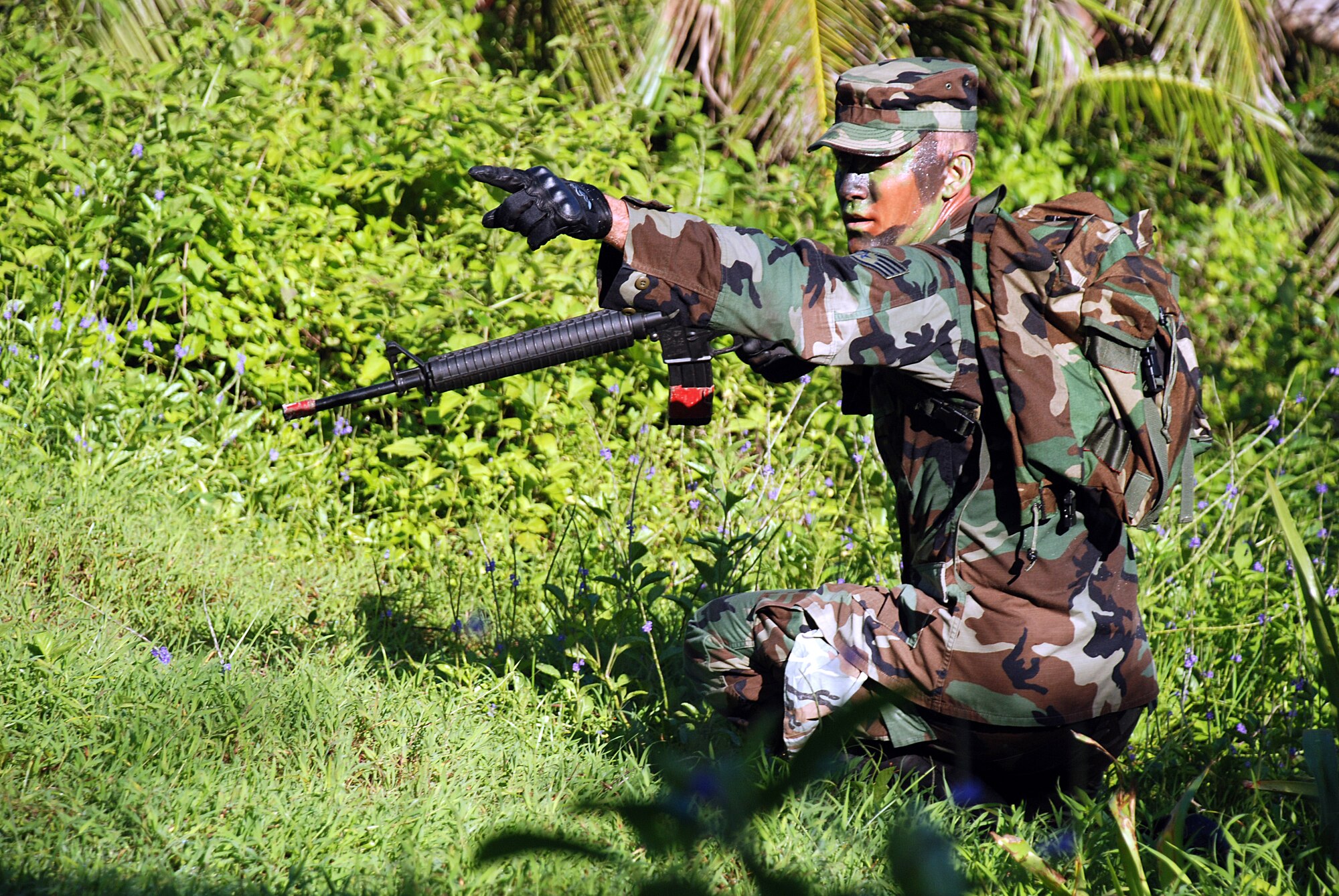 Staff Sgt. Ian Powell, 644th Combat Communications Squadron engaged with simulated hostile forces at a prisoner of war checkpoint during the annual Warrior Day Challenge held here July 11. Over nineteen teams participated in this years event. (U.S. Air Force photo by Senior Airman Brian Quay)