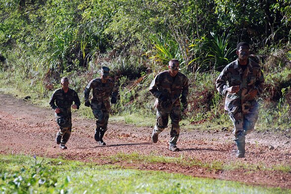 The 644th Combat Communications Squadron team, the Dragons ran through a pipeline to the first station of the competition and supply point during the annual Warrior Day Challenge held here July 11. Over nineteen teams participated in this years event. (U.S. Air Force photo by Senior Airman Brian Quay)