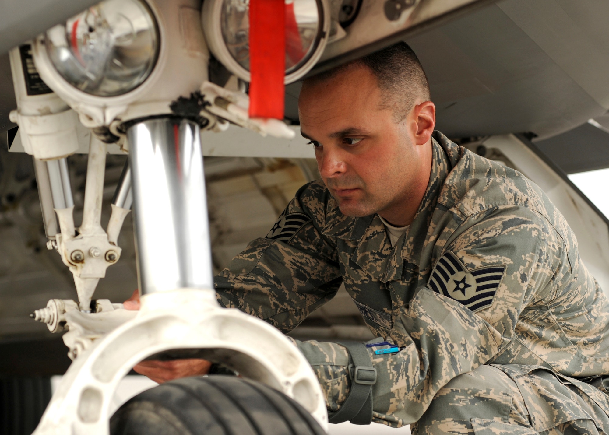 ELMENDORF AIR FORCE BASE, Alaska -- Tech. Sgt. Jason Hughes, 3rd Aircraft Maintenance Squadron, inspects an F-22A Raptor for any loose or missing parts during an inspection July 10. Sergeant Hughes was named as one of 12 Outstanding Airmen of the Year. (U.S. Air Force photo/Airman 1st Class Laura Turner)