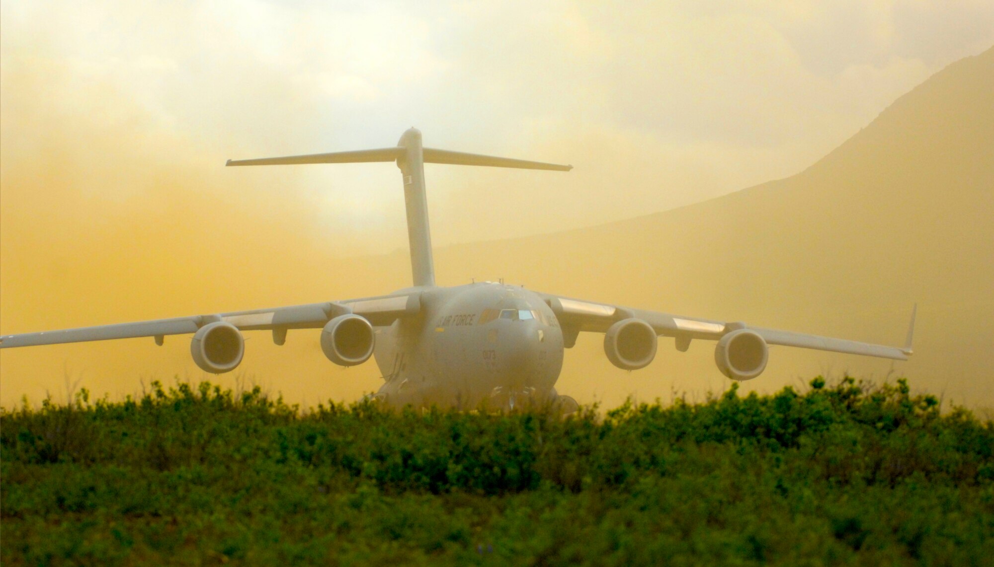 ELMENDORF AIR FORCE BASE, Alaska -- A 517th Airlift Squadron C-17 Globemaster III stirs up dust as it runs up its engines prior to the squadrons first dirt strip take off at Donnelly Field just south of Fort Greely, Alaska. (U.S. Air Force photo/Airman 1st Class Morgan Sneed)