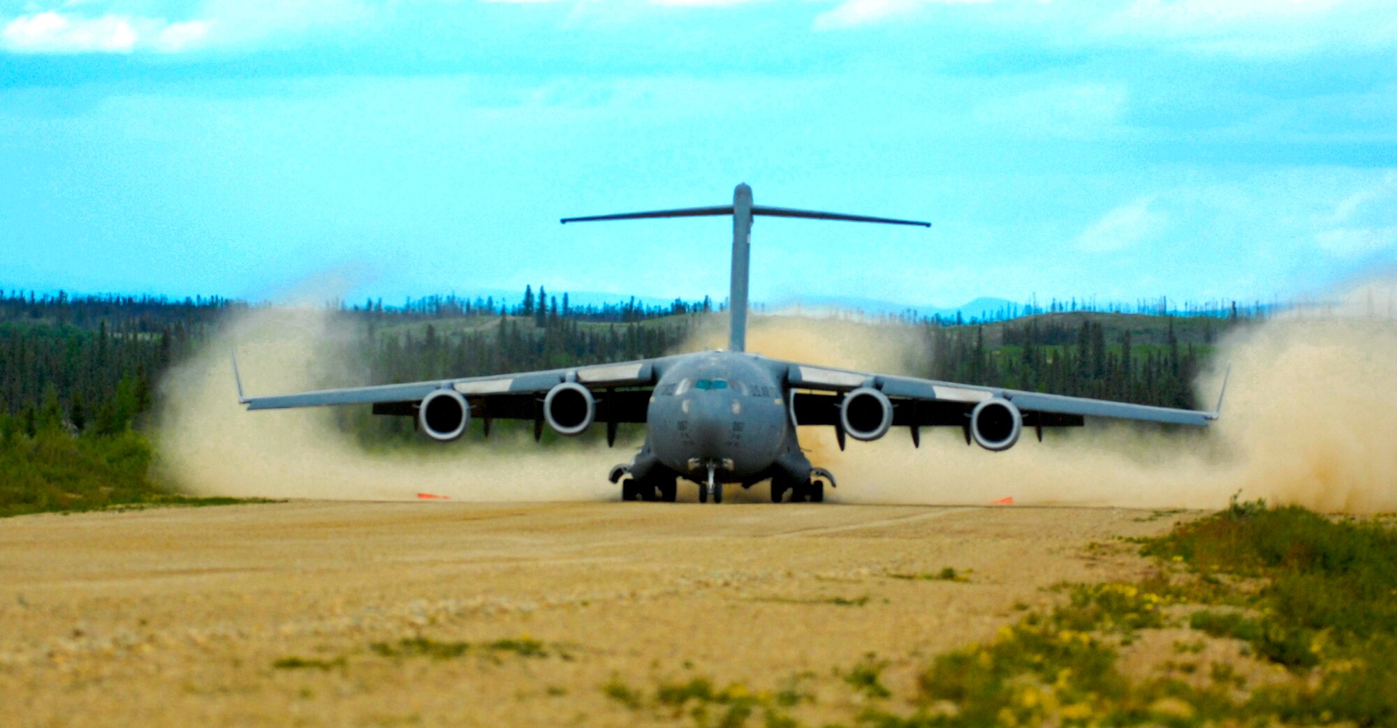 ELMENDORF AIR FORCE BASE, Alaska -- The second of two C-17 Globemaster IIIs land at Donnelly Field just south of Fort Greely, Alaska. These landings were the first C-17 dirt landings in Alaska. (U.S. Air Force photo/Airman 1st Class Morgan Sneed)