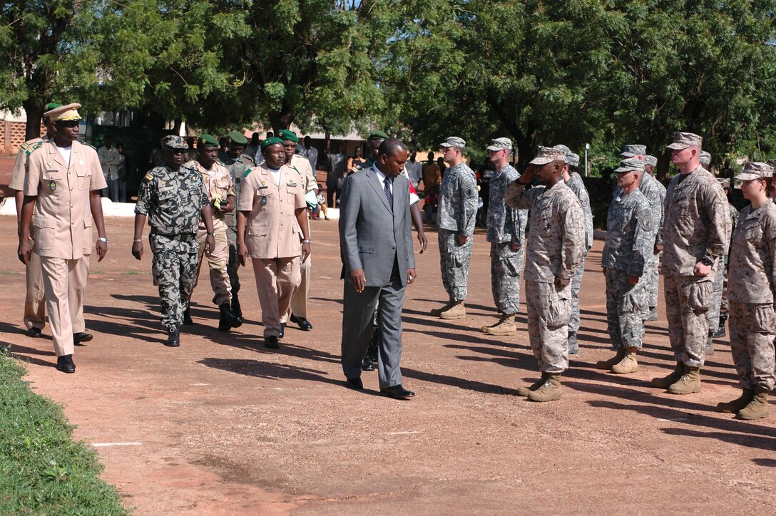 Natie Plea, Mali Minister of Defense and Veterans, greets the MEDFLAG 08 team July 14 during an opening ceremony parade for the two-week long mission. More than 90 servicemembers deployed to Bamako, Mali, July 11 for MEDFLAG 08, a multinational medical training exercise designed to enhance medical capabilities and readiness for U.S. and African forces. (U.S. Air Force photo/Senior Airman Justin Weaver)