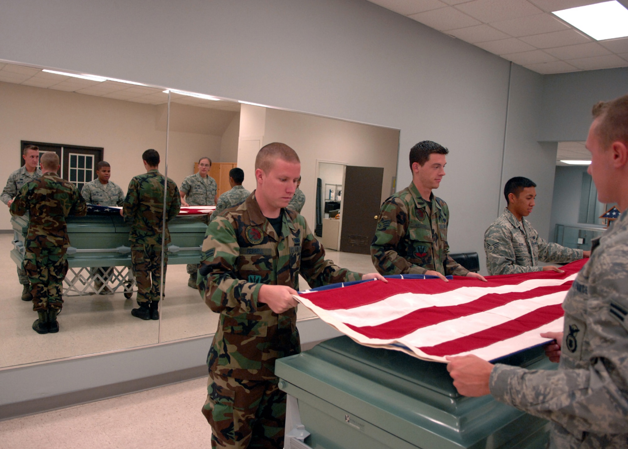MOODY AIR FORCE BASE, Ga. – Moody Air Force Base Honor Guard Airmen practice folding the flag for funeral ceremonies here July10. The base Honor Guard trains constantly to provide respectful ceremonies for military members. (U.S. Air Force photo by Airman Joshua Green) 

