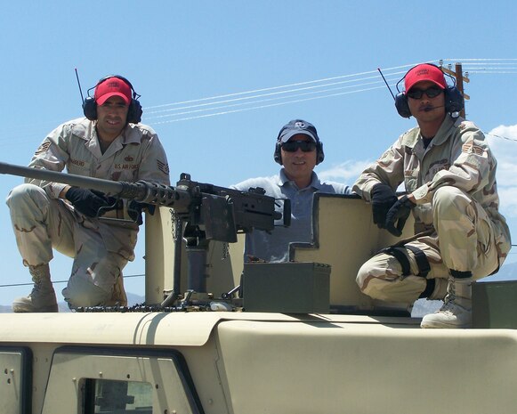 Dr. Samuel D. Kleinman, Deputy Under Secretary of Defense for Readiness, poses with members of the 99th Ground Combat Training Squadron during a visit to Nellis, July 11, 2008. Dr. Kleinman's visit was coordinated by the USAF Warfare Center Protocol office. The office was received the George Washington Award for Protocol Excellence for the second year running. (U.S. Air Force photo by Vanneca Phelps)