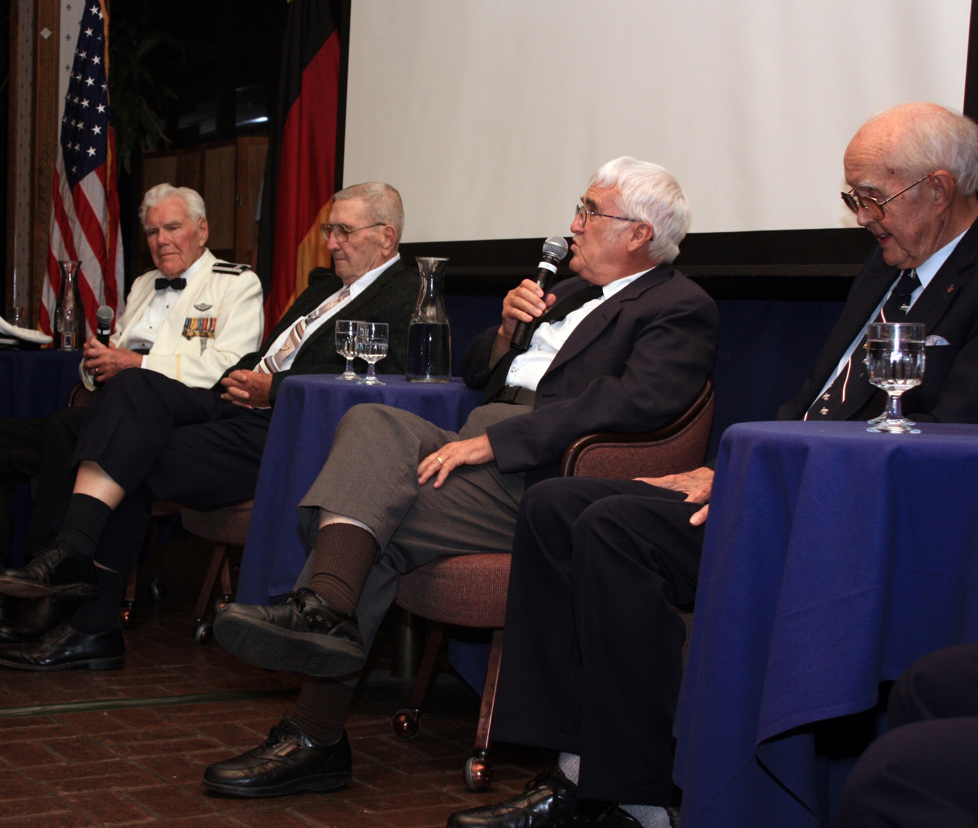 Four Berlin Airlift veterans, all from New Mexico, answered questions in an open discussion during  the commemoration of the 60th Anniversary of the Berlin Airlift at the Raptors Nest at Holloman Air Force Base, N.M., July 10. The veterans (from left to right) include retired Col. William Norris, Mr. Ivan Thomas, Mr. Norman Melvin, and retired Chief Master Sgt. Thomas Tatly. (German air force photo/Chief Master Sgt. Robert Meints)
