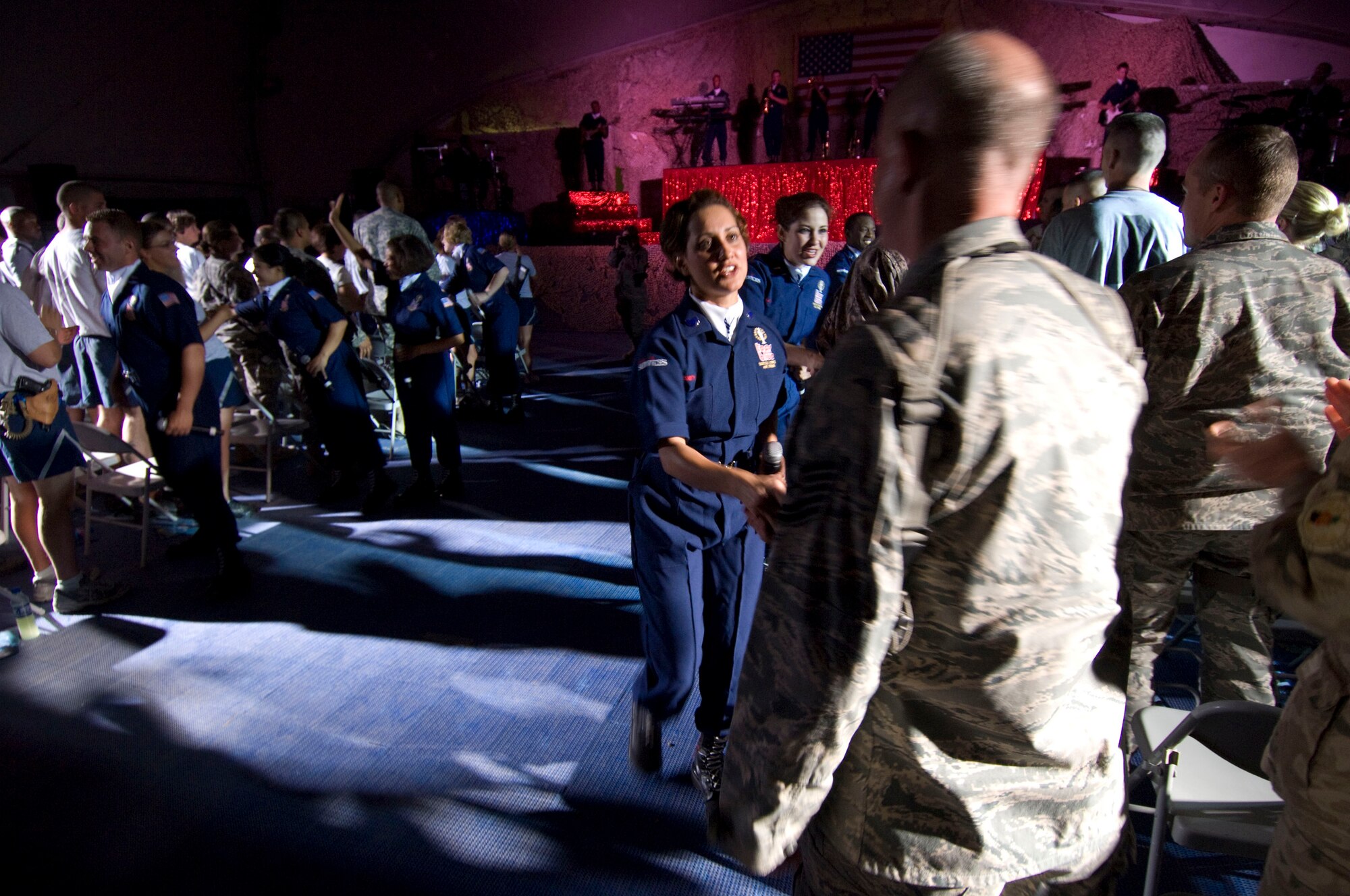 BAGRAM AIR FIELD, Afghanistan -- Tech. Sgt. Chandra Smith, vocalist for Tops in Blue, meets and greets an audience member following a performance here on July 13, 2008. Vocalists and instrumentalists representing a wide range of career fields across the Air Force auditioned to tour for 9 months performing the 2008 show "Deja Blue" all over the world. Sergeant Smith works for the command support staff, 162nd Fighter Wing (Alert Detachment), Air National Guard, Davis-Monthan Air Force Base, Ariz., and hails from Clarinda, Iowa. (U.S. Air Force photo by Staff Sgt. Samuel Morse)