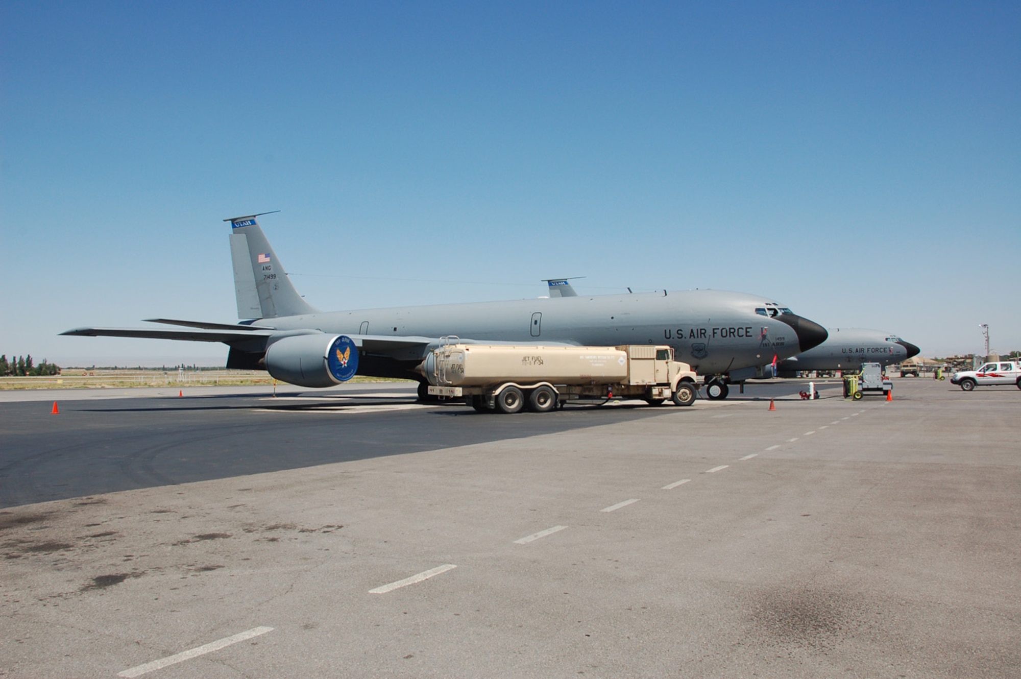 MANAS AIR BASE, Kyrgyz Republic --Two KC-135 Stratotankers from the Utah Air National Guard's 151st Air Refueling Wing are prepared for refueling missions over Afghanistan July 2, at Manas Air Base, Kyrgyz Republic. More than 130 Guardsmen and four KC-135s from the 151st ARW deployed to the 376th Air Expeditionary Wing in late June to support refueling operations in Afghanistan. They are scheduled to return to their Salt Lake City unit in early August. (Air Force photo / Maj. Damien Pickart)