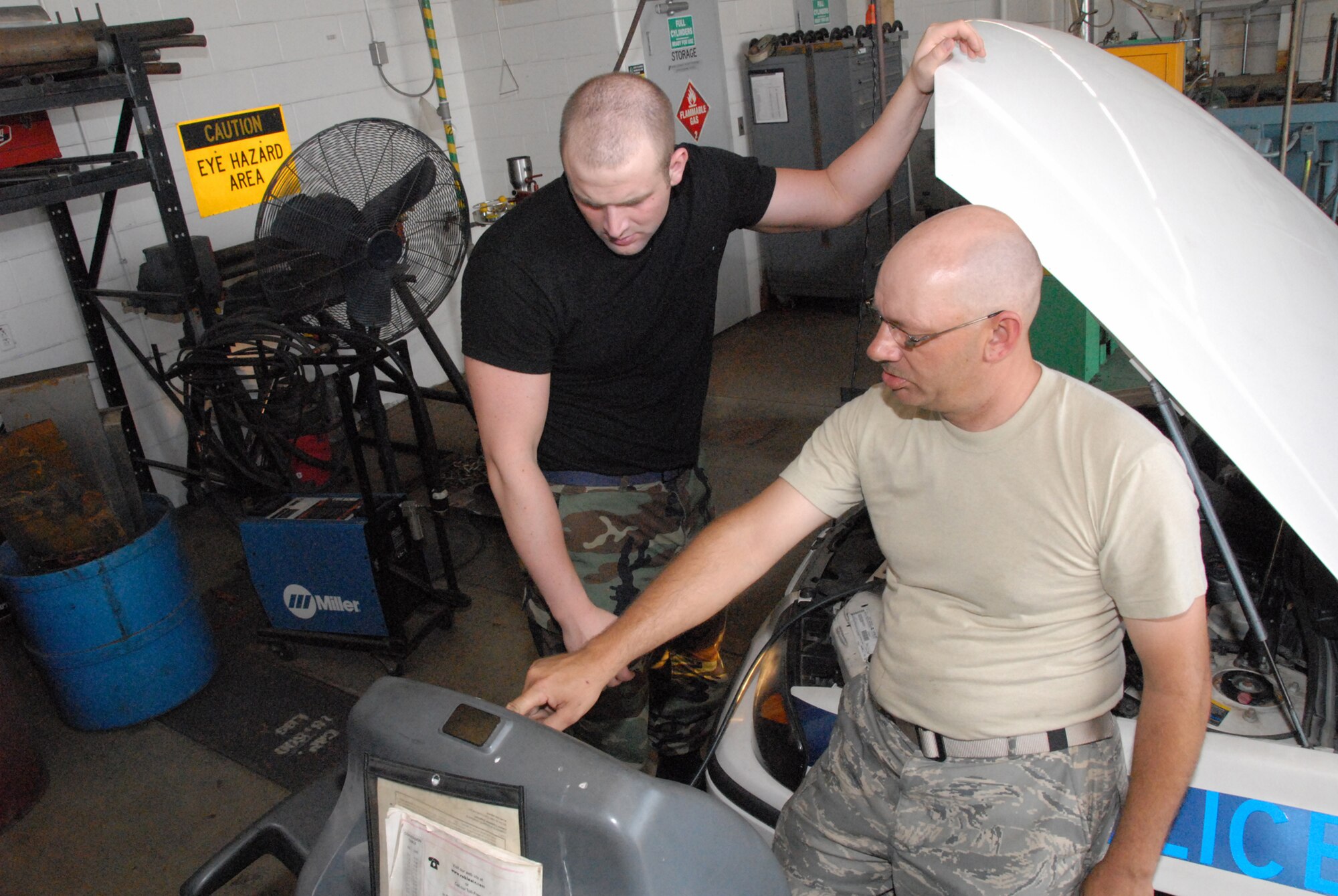 Staff Sgt. Andrew Carrender and Tech. Sgt. David Arnold, vehicle mechanics with the 442nd Logistics Readiness Squadron, monitor a diagnostic computer hooked up to a car they are repairing. The 442nd LRS is a part of the 442nd Fighter Wing, an Air Force Reserve Command A-10, Thunderbolt II, fighter unit based at Whiteman Air Force Base, Mo. (US Air Force photo/MSgt. Bill Huntington)