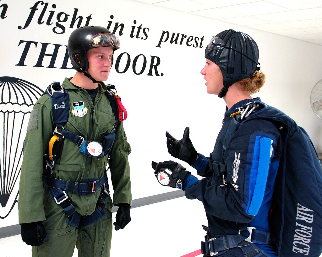 U.S. Air Force Academy Jumpmaster Cadet 1st Class Lindsey Robinson briefs Cadet 3rd Class David Barron during Airmanship 490, Basic Parachuting -  an airmanship program where cadets earn their basic jump wings after successfully completing five free-fall jumps at the academy in Colorado, July 7, 2008.