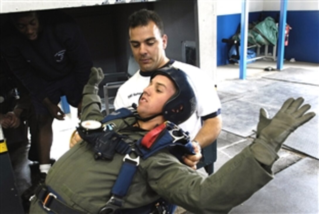 U.S. Air Force Academy Cadet 3rd Class Cody Moorhead receives free-fall techniques training from Staff Sgt. Joseph Valente, an airmanship instructor at the academy in Colorado, July 7, 2008.