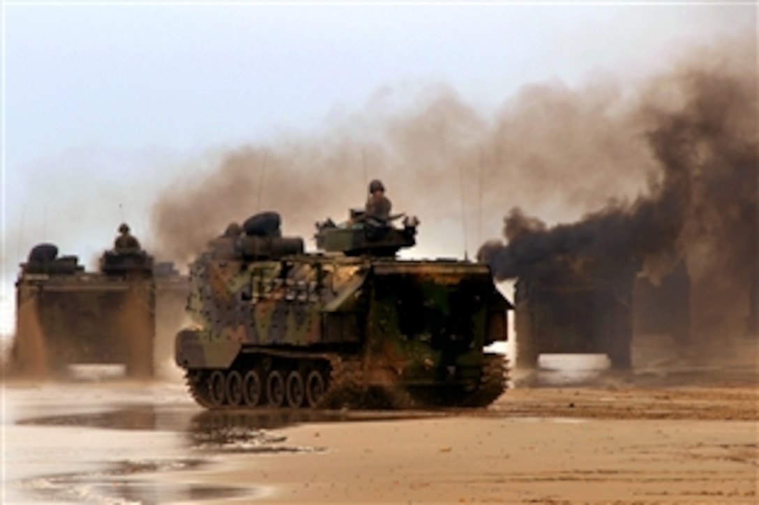 U.S. Marines aboard amphibious assault vehicles travel across Red Beach on Camp Pendleton, Calif., during Joint Logistics Over-the-Shore 2008 operations, July 10, 2008.