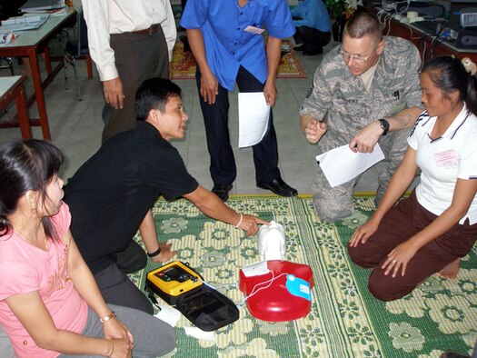 VIENTIANE, Laos -- Master Sgt. John Strothenke, International Health Specialist from Eielson AFB, Alaska is teaching fundamentals of U.S. based emergency medical systems to Laotian Dr. Vilaphone and Nang Phoukham a nurse from local hospital 103 here July 7. This first responder course is being taught to fit the needs of their country and build capacity in Laos. (U.S. Air Force photo/Master Sgt. Tracy Lewis) 
